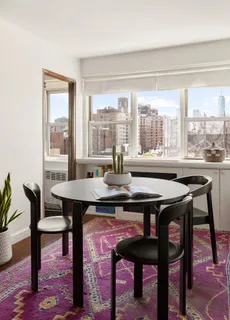a view of a dining room with furniture window and outside view