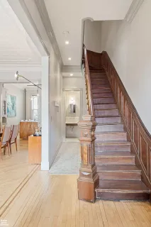 a view of entryway and hall with wooden floor