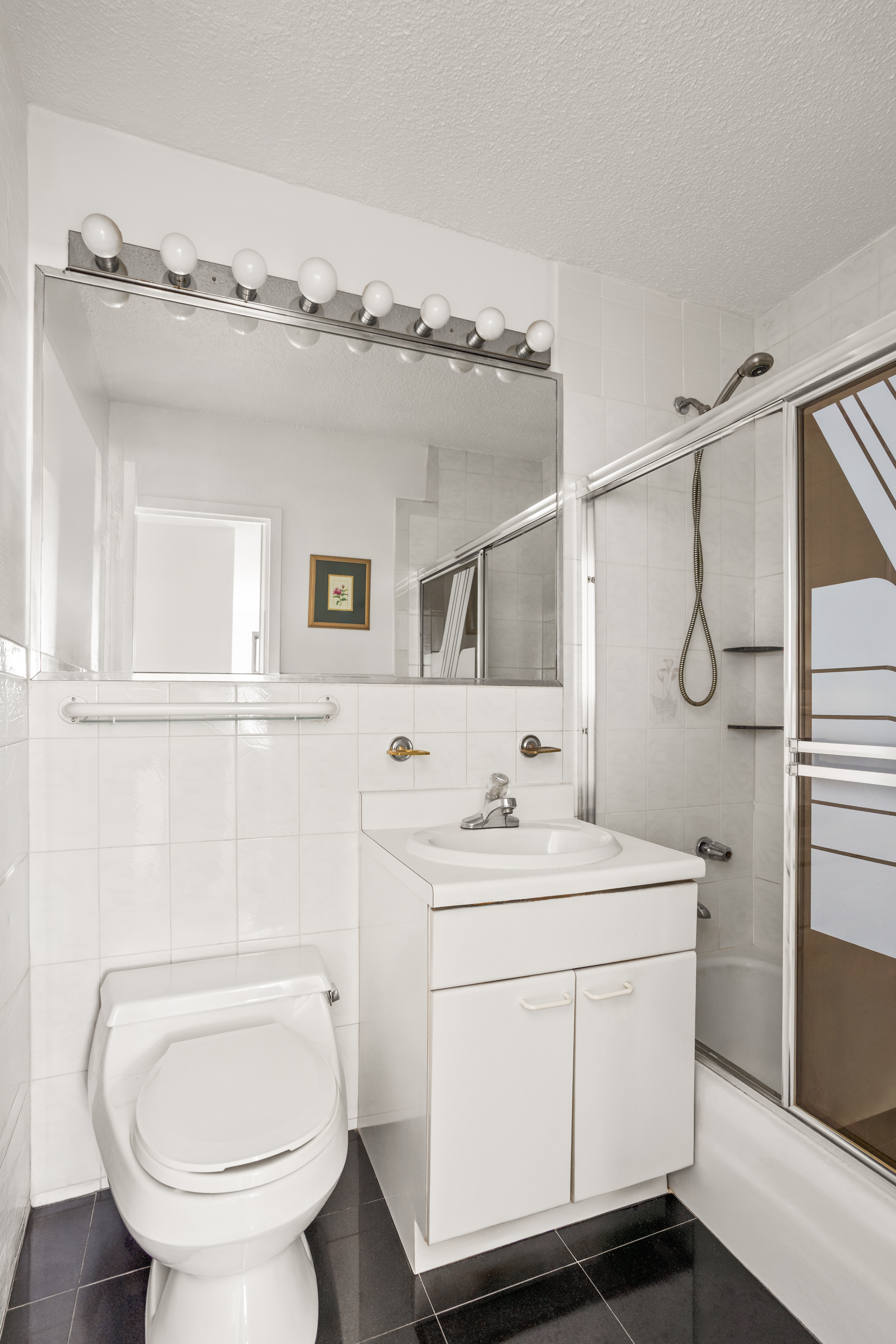 39-60 54th Street, Unit 4R Queens, NY 11377 - Photo 7 of 14 a bathroom with a toilet sink shower and mirror