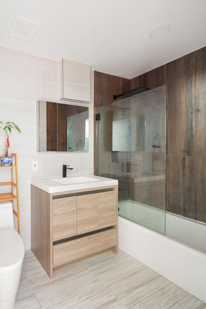 136-140 West 23rd Street, Unit PHD Manhattan, NY 10011 - Photo 13 of 15 a bathroom with a bathtub and a sink