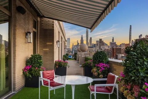 a view of a chairs and table in a patio