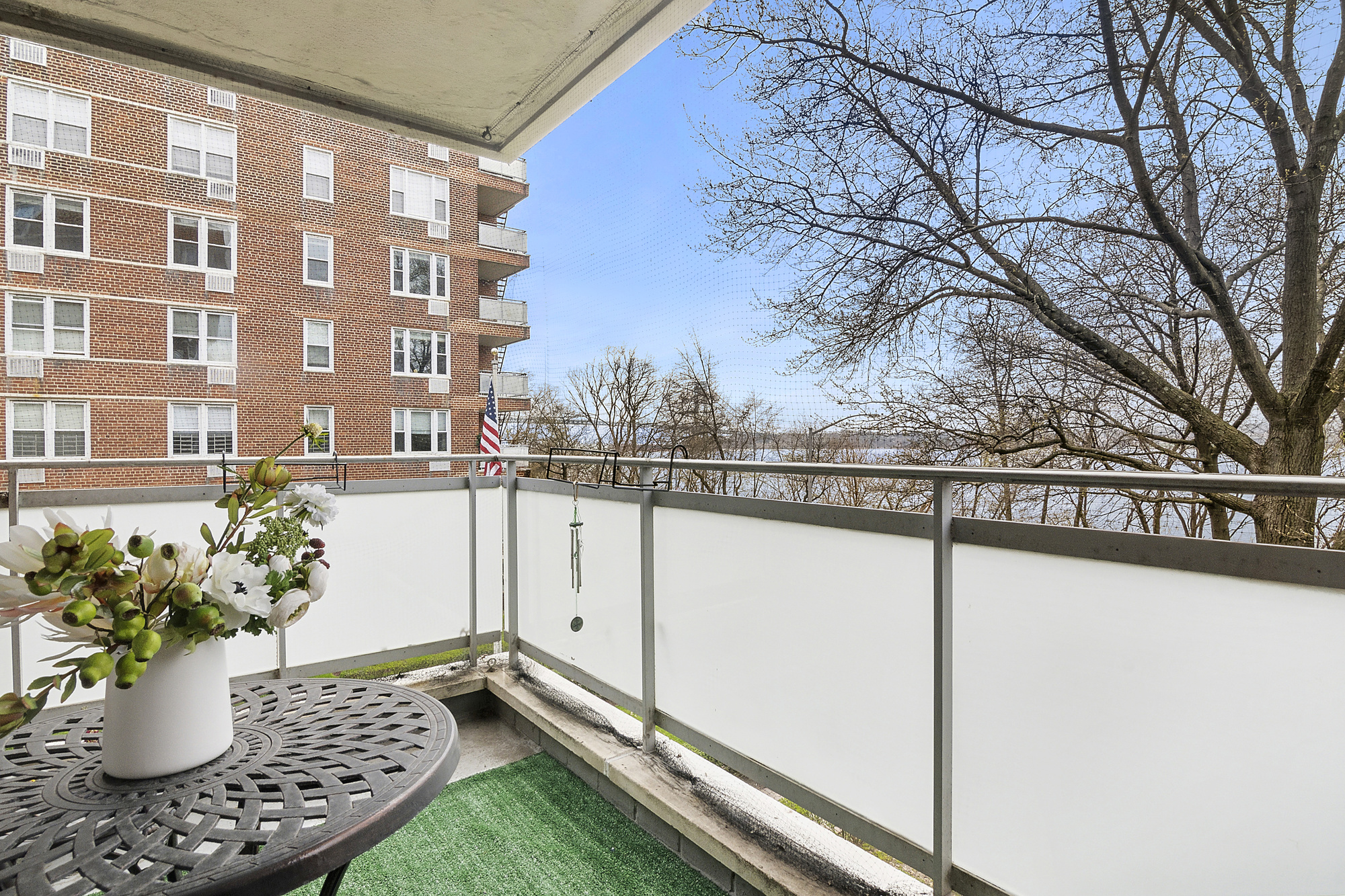 a view of a balcony with potted plants