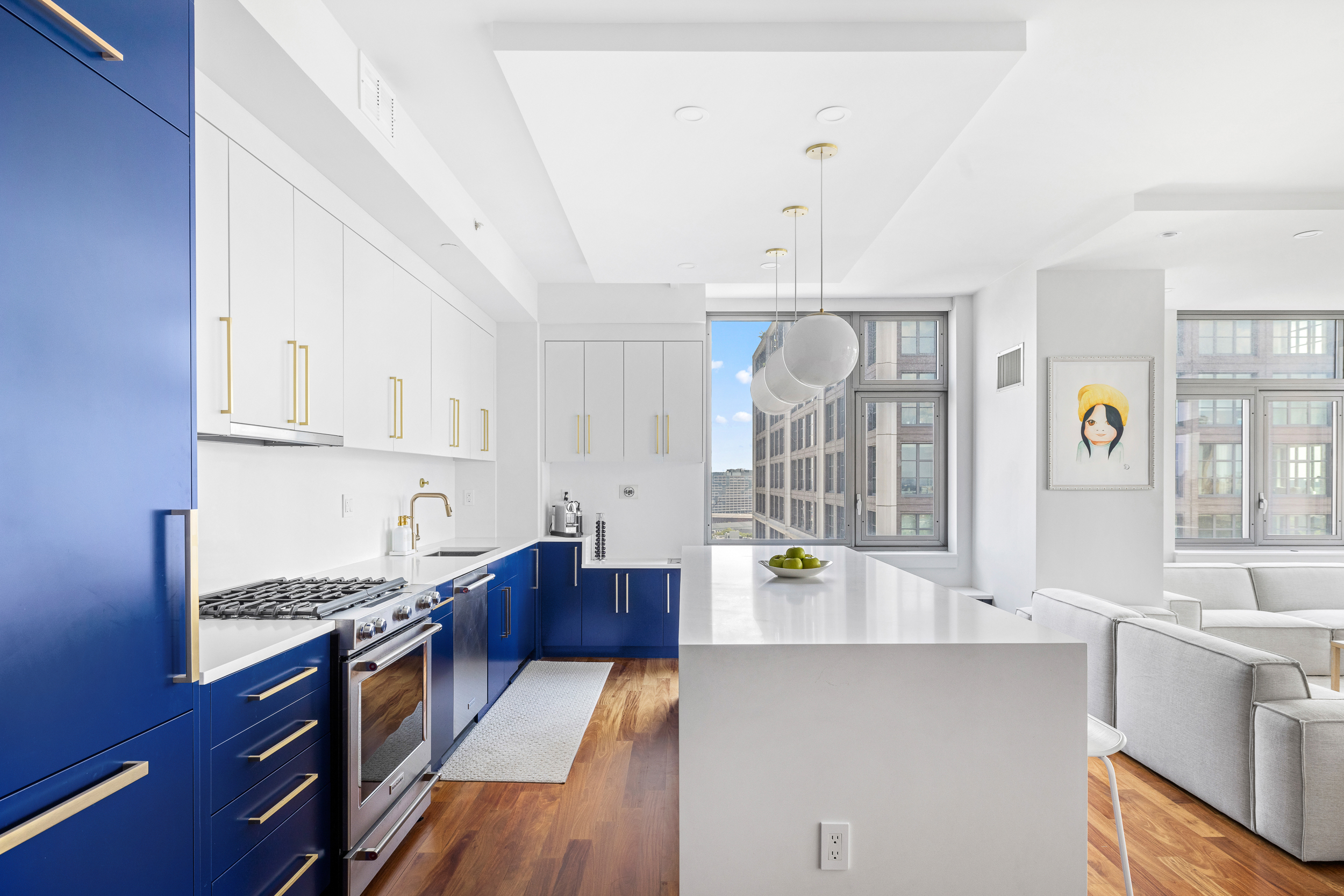 100 Jay Street, Unit 20F Brooklyn, NY 11201 - Photo 1 of 20 a large kitchen with a wooden floor and cabinets