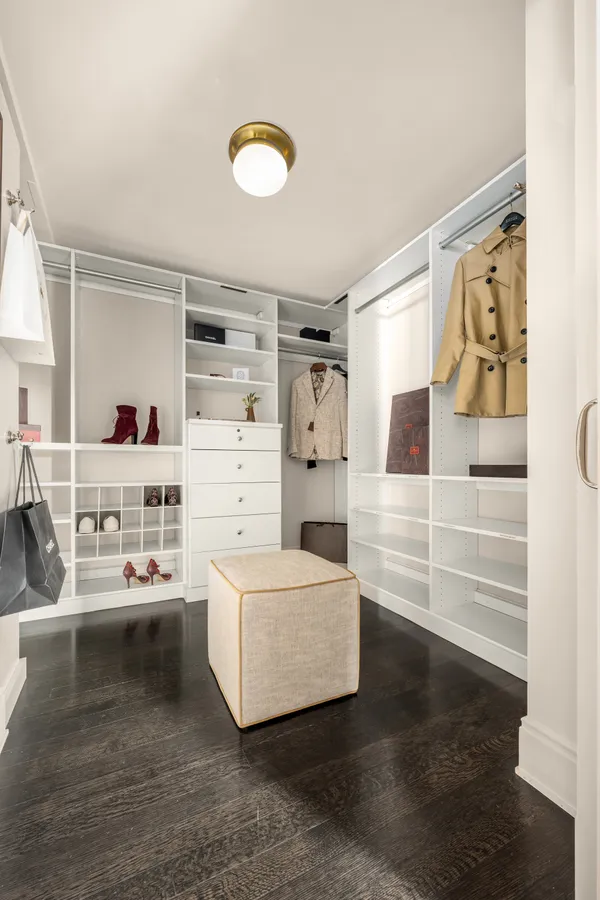 a living room with furniture a window and a table