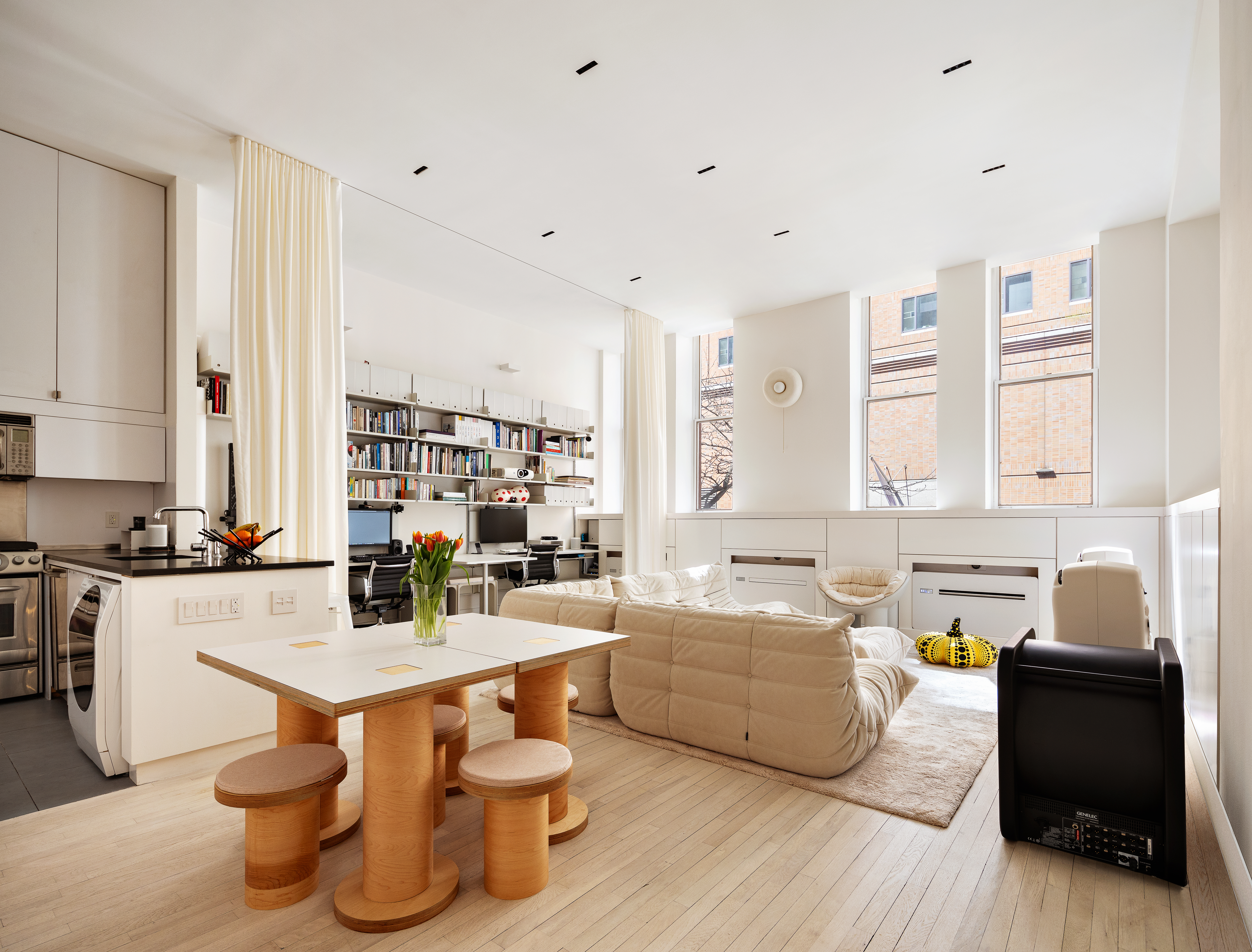 a kitchen with a sink and white cabinets