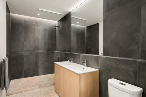 a bathroom with a sink and mirror