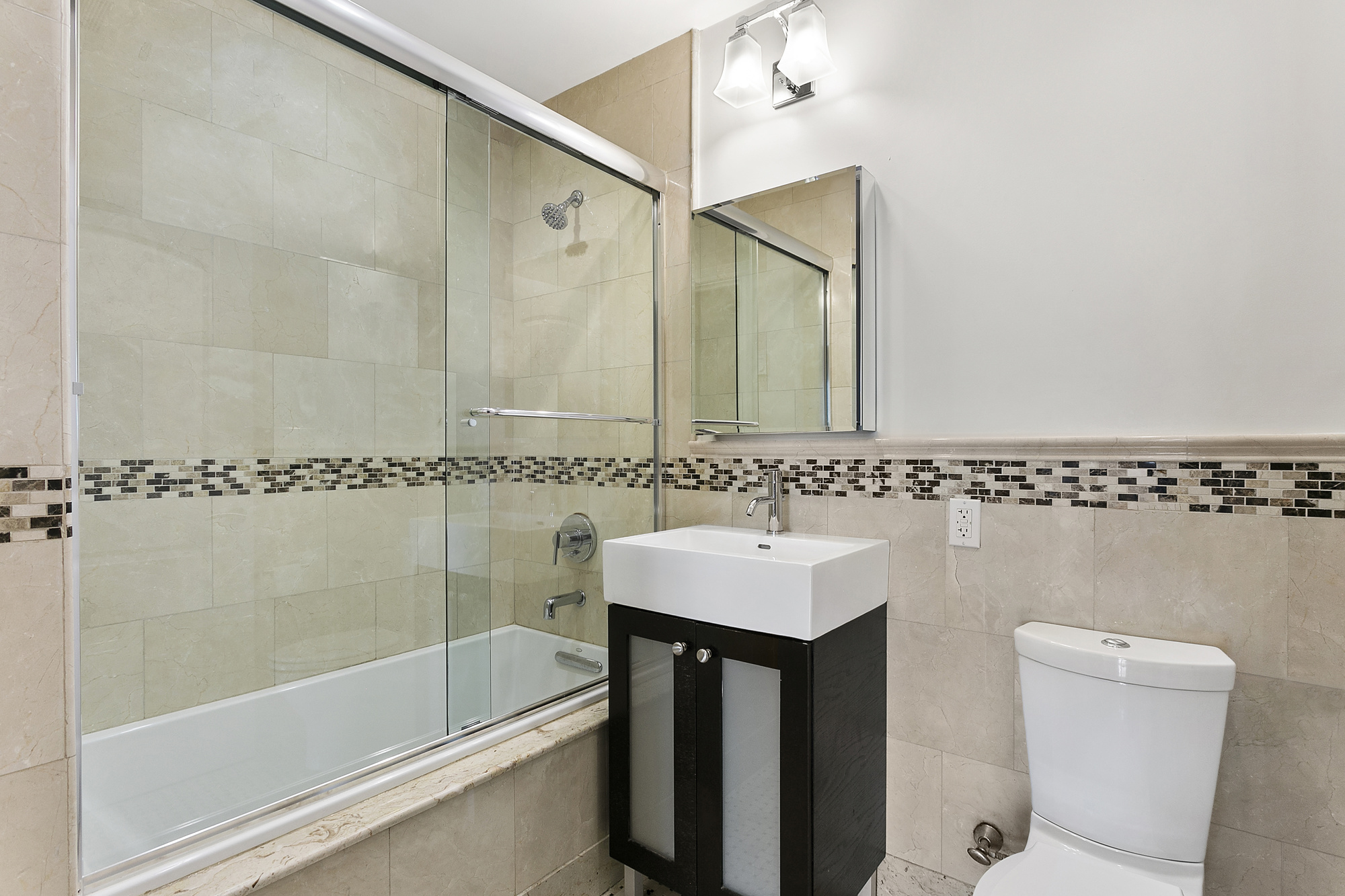 233 Pacific Street, Unit 3F Brooklyn, NY 11201 - Photo 7 of 11 a bathroom with a sink a toilet and shower