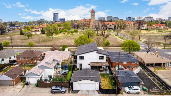 an aerial view of residential houses with outdoor space