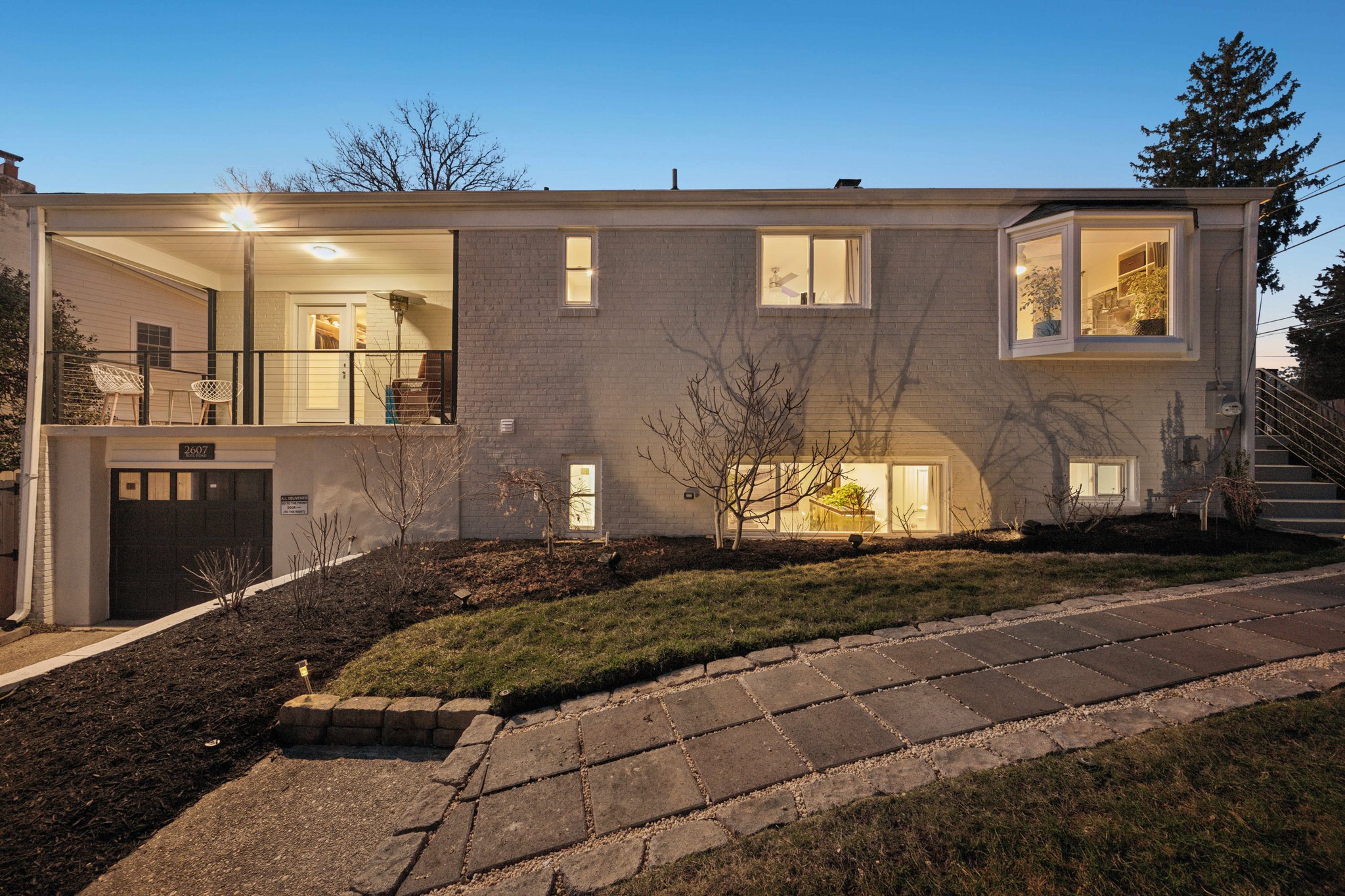 a front view of a house with a yard