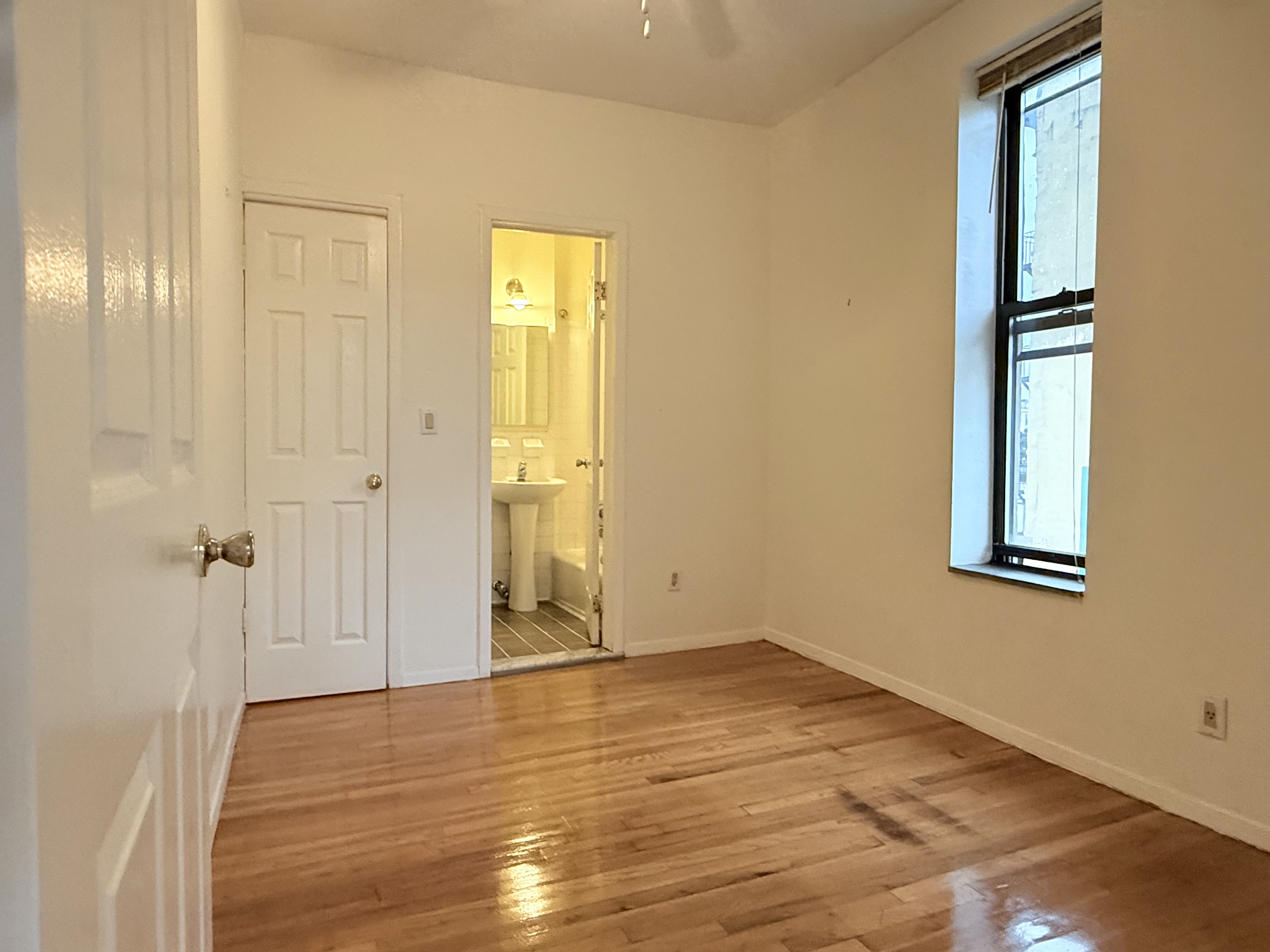 1672 Park Avenue, Unit 4A Manhattan, NY 10035 - Photo 10 of 11 a view of an empty room with closet and a window