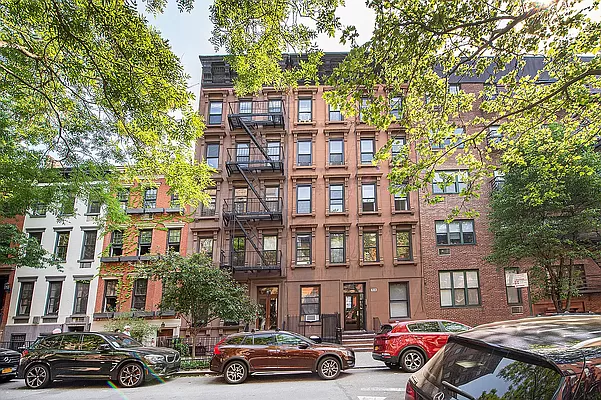 316 West 19th Street, Unit 4W Manhattan, NY 10011 - Photo 6 of 7 a buildings and car parked in front of it