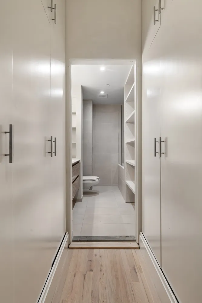 a bathroom with a glass shower door