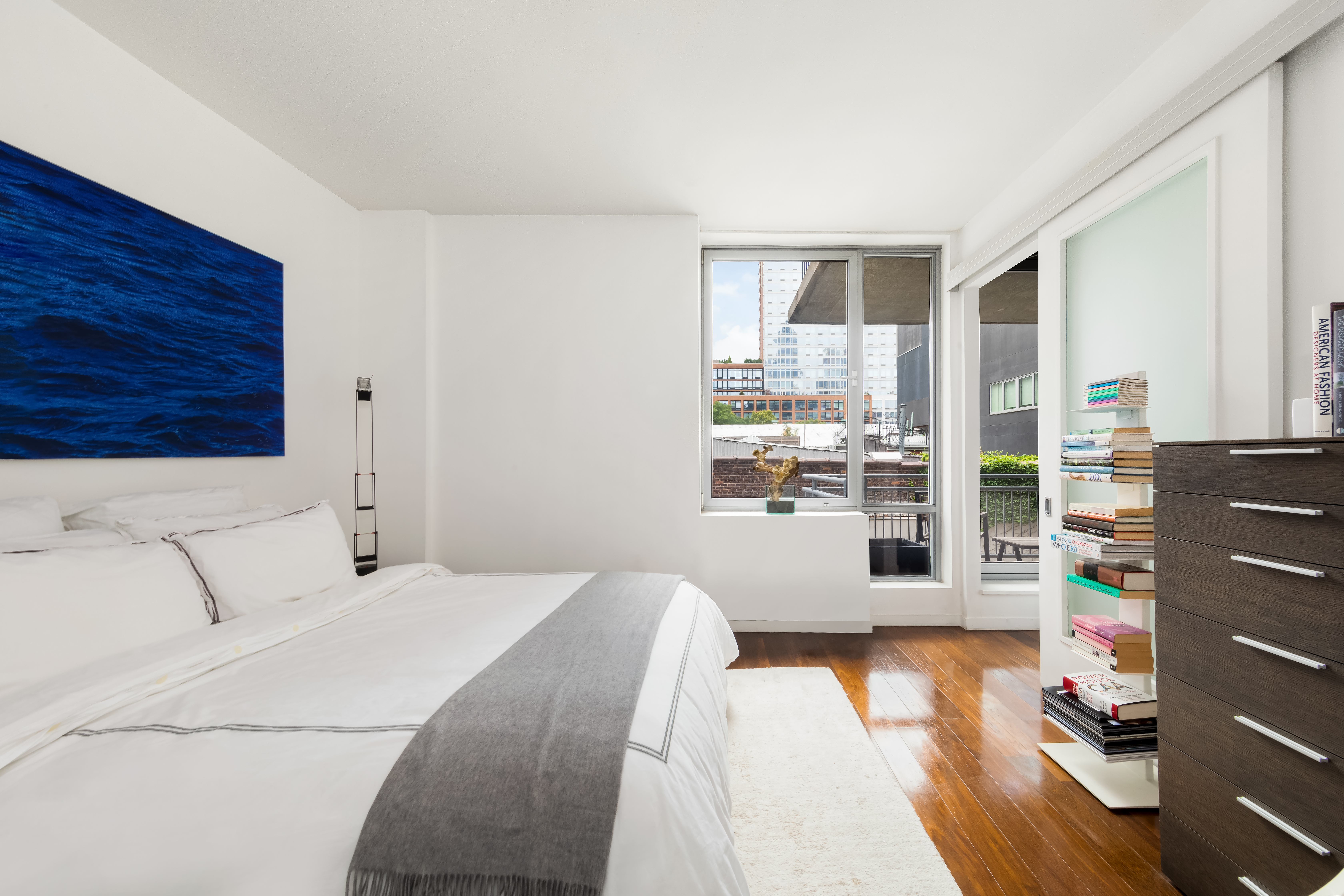 444 West 19th Street, Unit 403 Manhattan, NY 10011 - Photo 4 of 6 a bedroom with a bed and a window