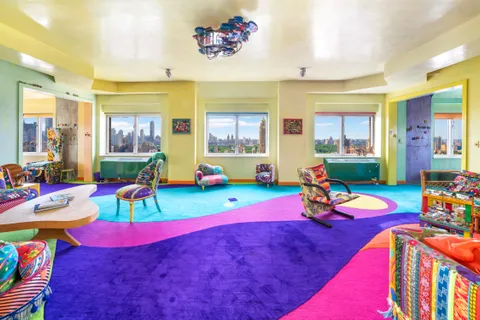 a play room with furniture toys and a dining table