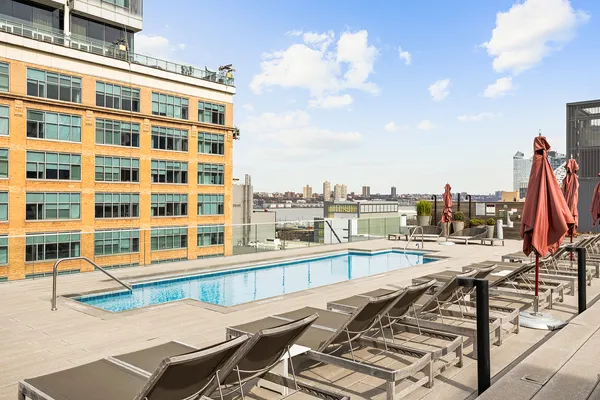 a view of a swimming pool with a lounge chair