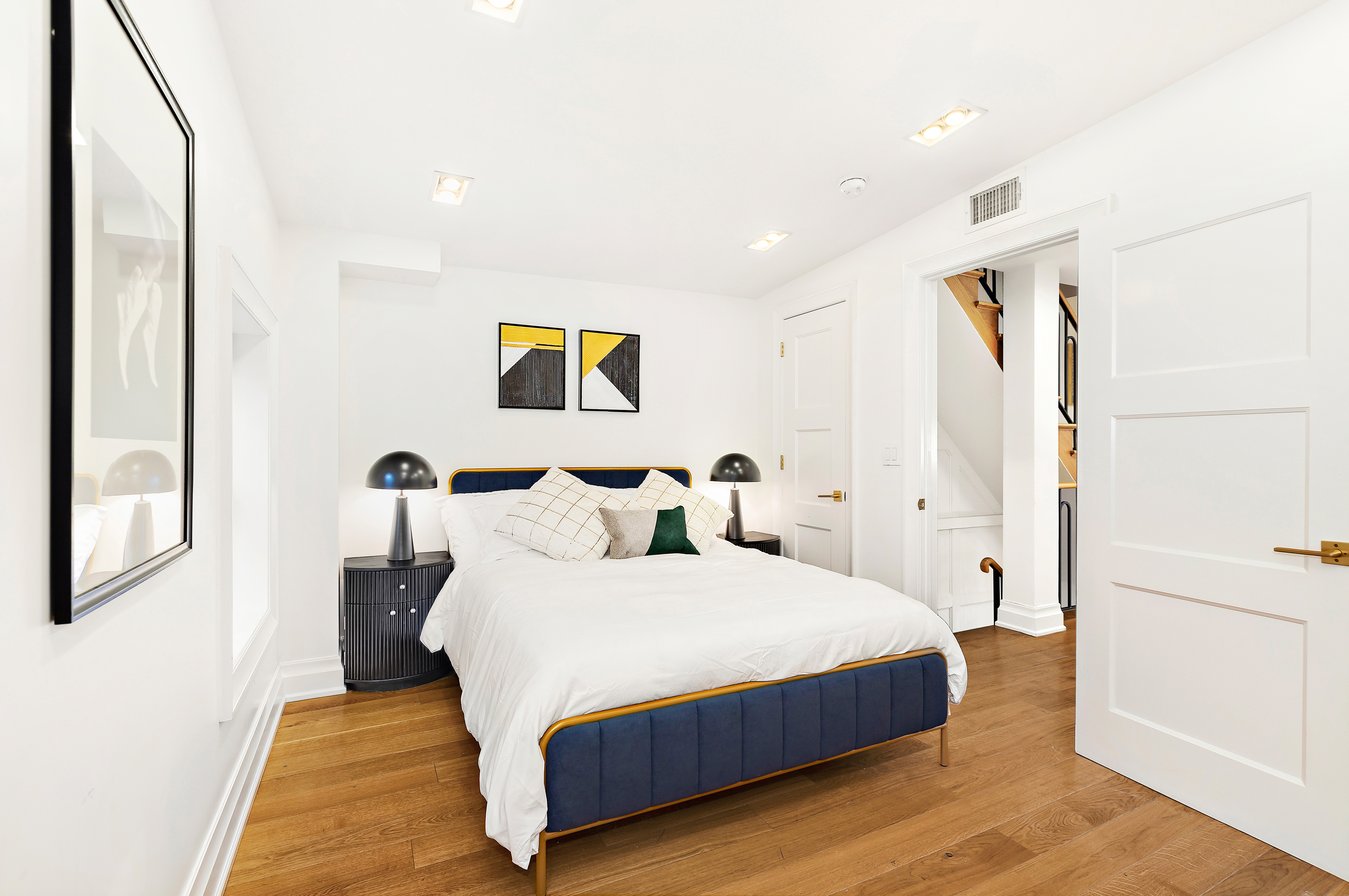 134 East 36th Street Manhattan, NY 10016 - Photo 23 of 28 a bedroom with a bed and a painting on the wall