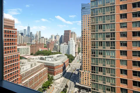 a view of a city with tall buildings