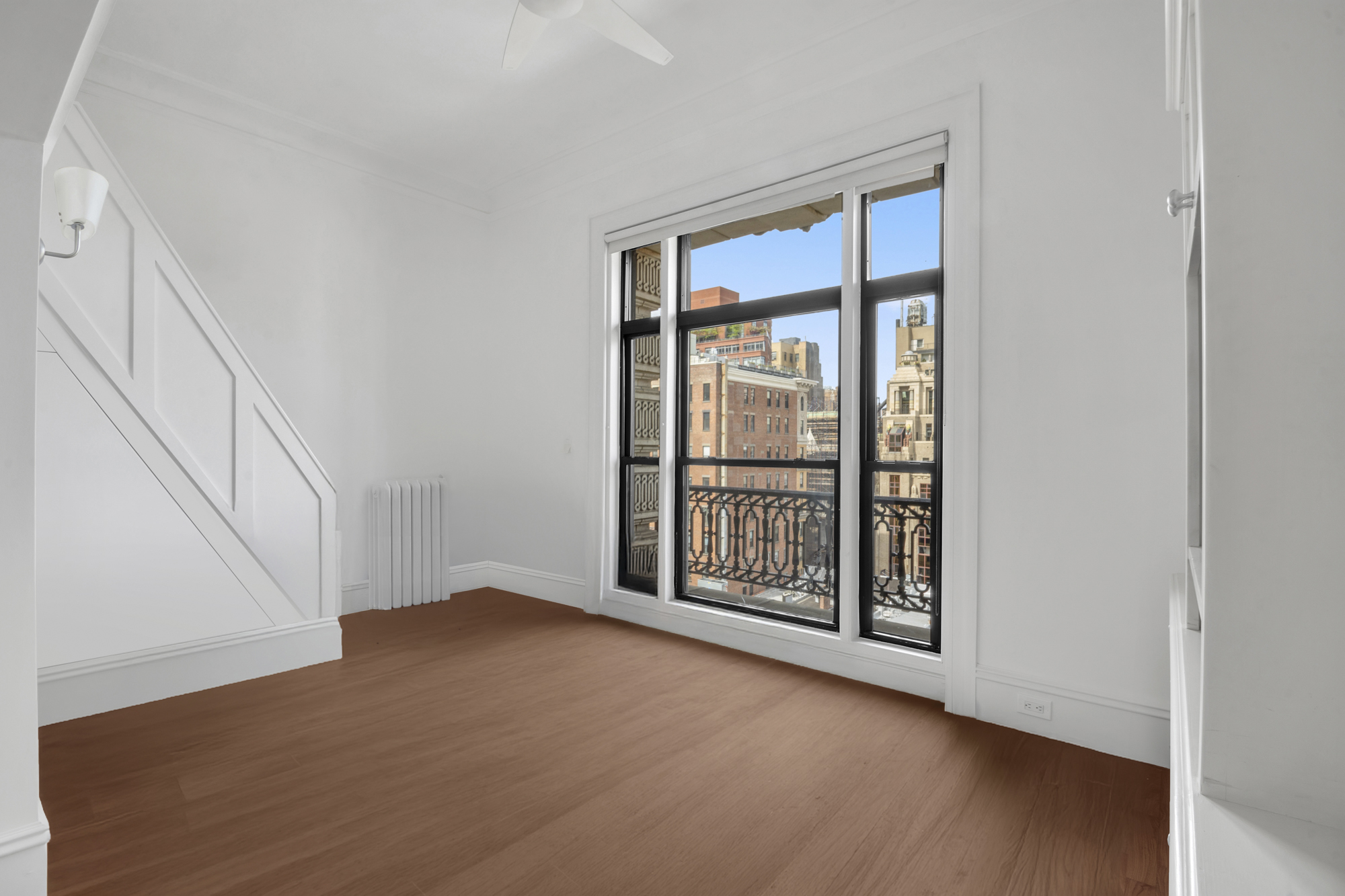 140 West 69th Street, Unit 107A Manhattan, NY 10023 - Photo 4 of 15 a view of an empty room with a window