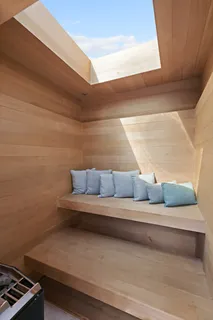 a view of a patio with table and chairs potted plants