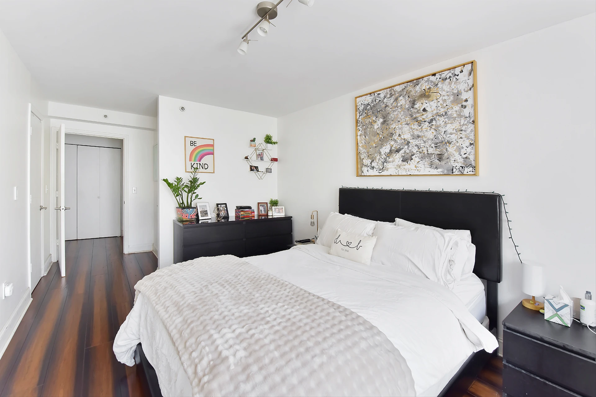 2235 Frederick Douglass Boulevard, Unit 2D Manhattan, NY 10027 - Photo 7 of 14 a bedroom with a bed and wooden floor