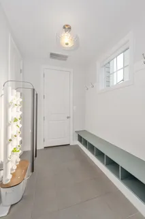 a bathroom with bathtub and window