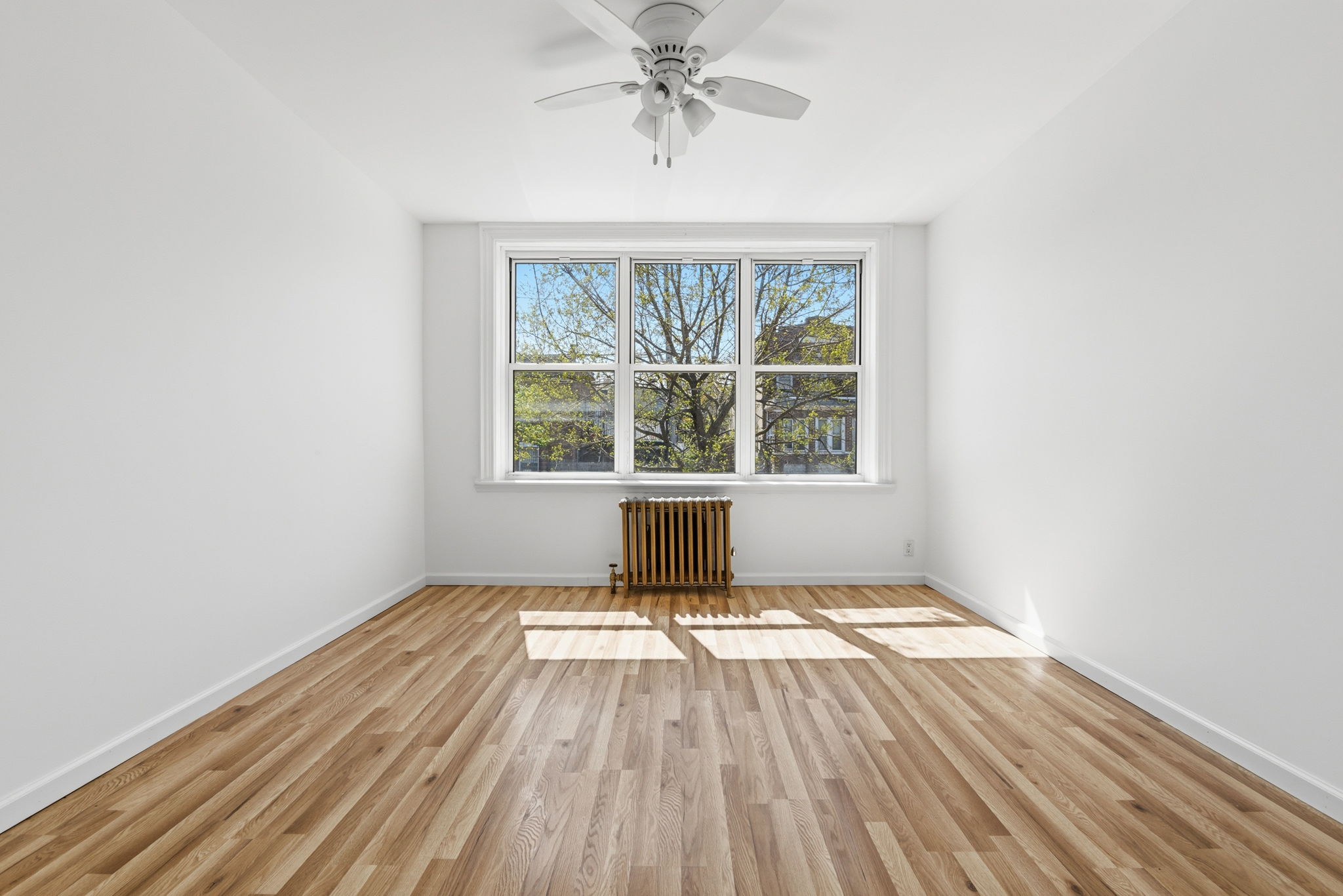 37 Chester Avenue Brooklyn, NY 11218 - Photo 3 of 14 an empty room with a window