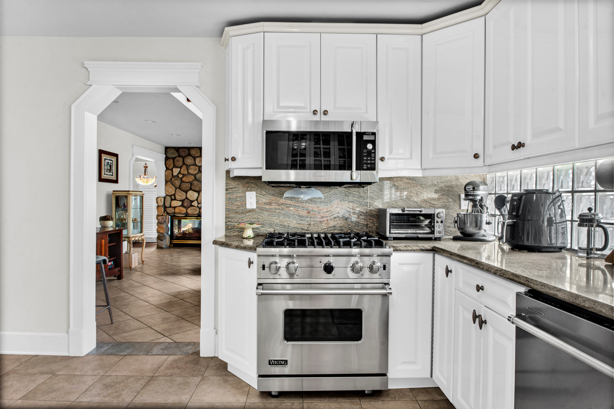 165 Swaim Avenue Staten Island, NY 10312 - Photo 7 of 45 a kitchen with stainless steel appliances granite countertop a stove a sink and a microwave