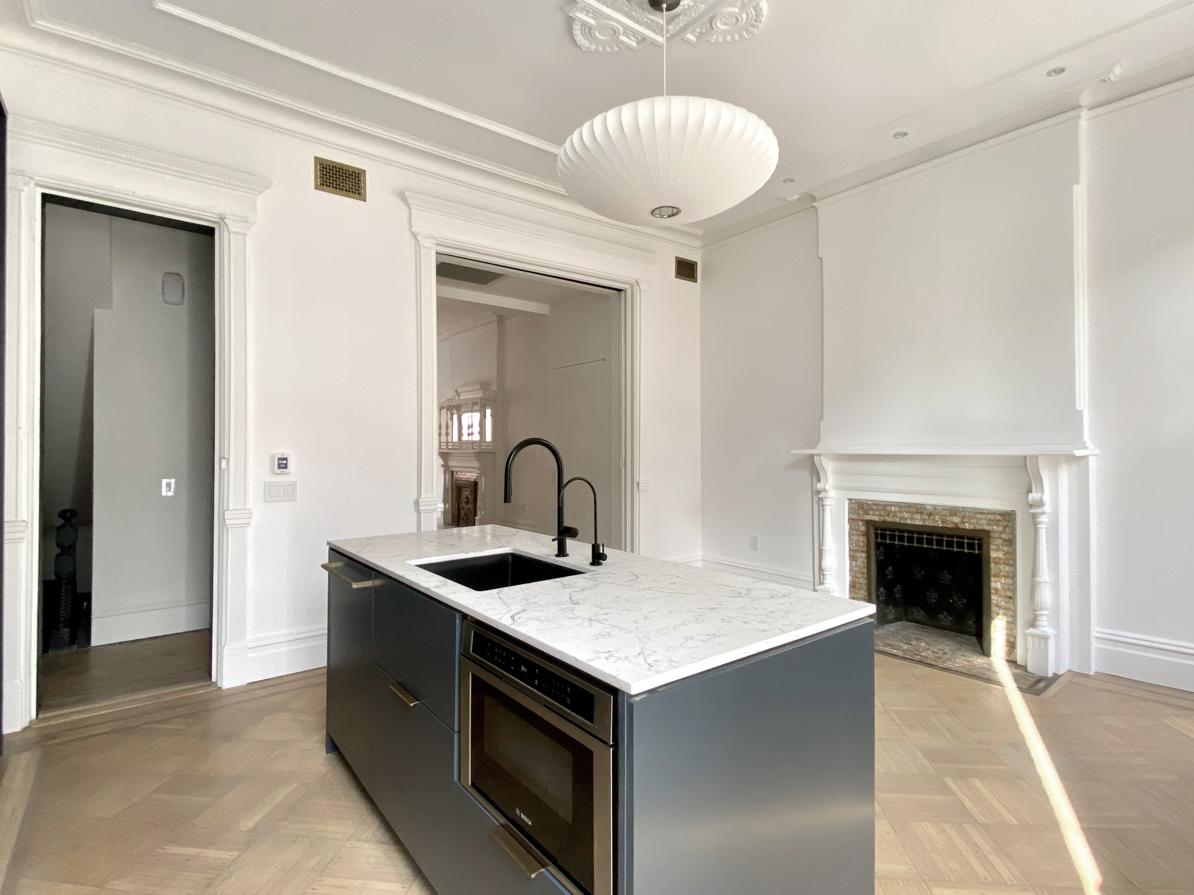 1420 Pacific Street, Unit 1 Brooklyn, NY 11216 - Photo 4 of 30 a kitchen with a stove and a fireplace