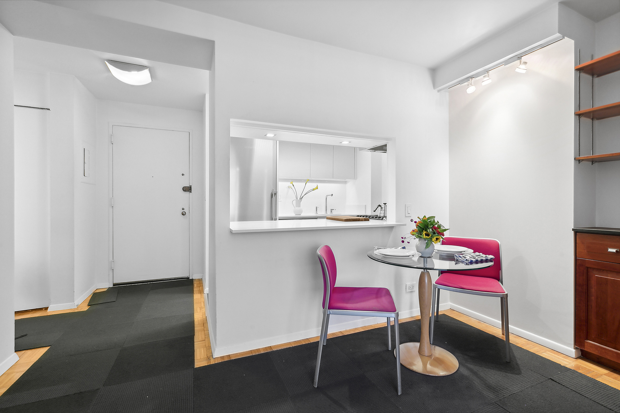 303 Greenwich Street, Unit 7F Manhattan, NY 10013 - Photo 2 of 7 a living room with furniture and wooden floor