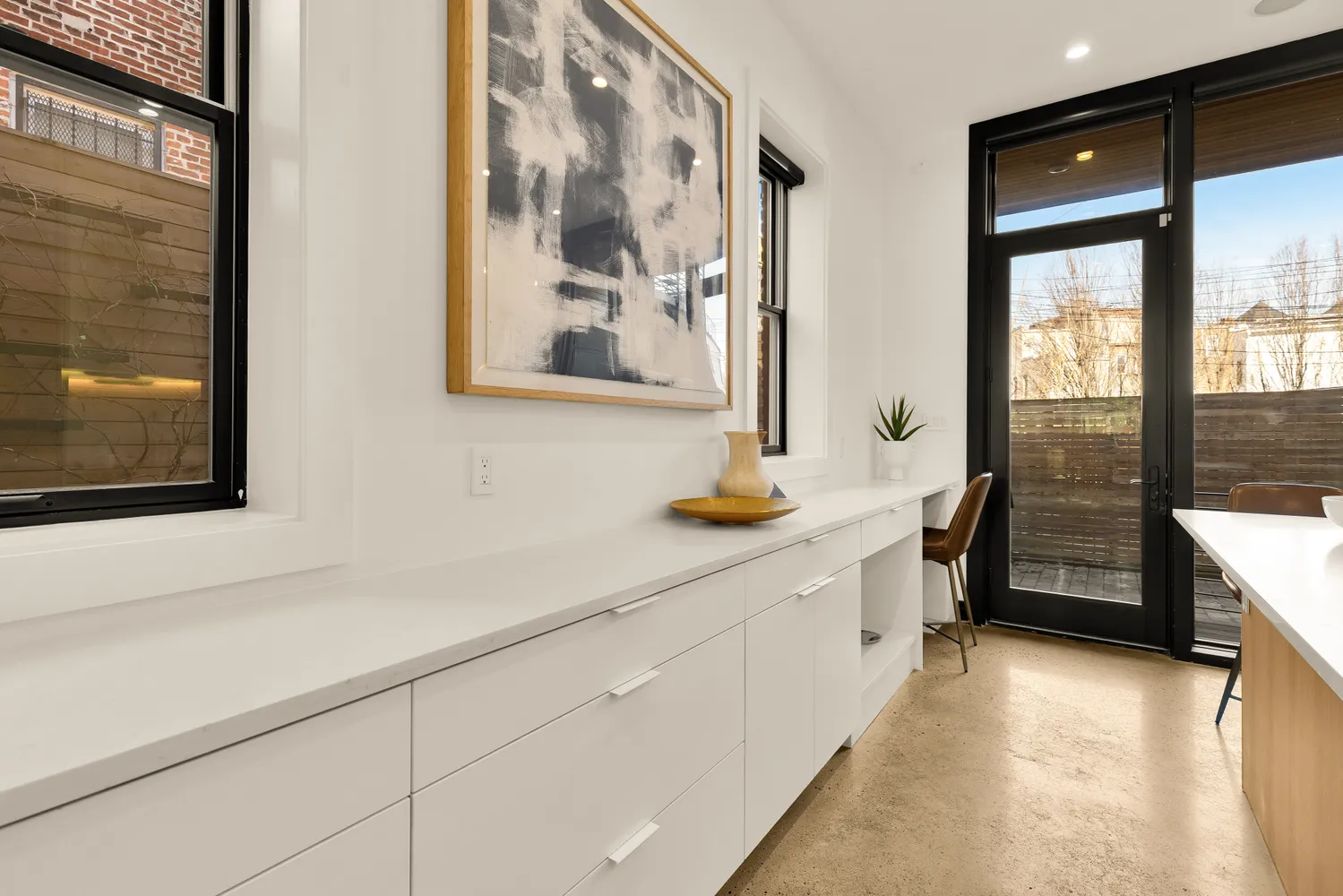a kitchen with stainless steel appliances a sink and a large window