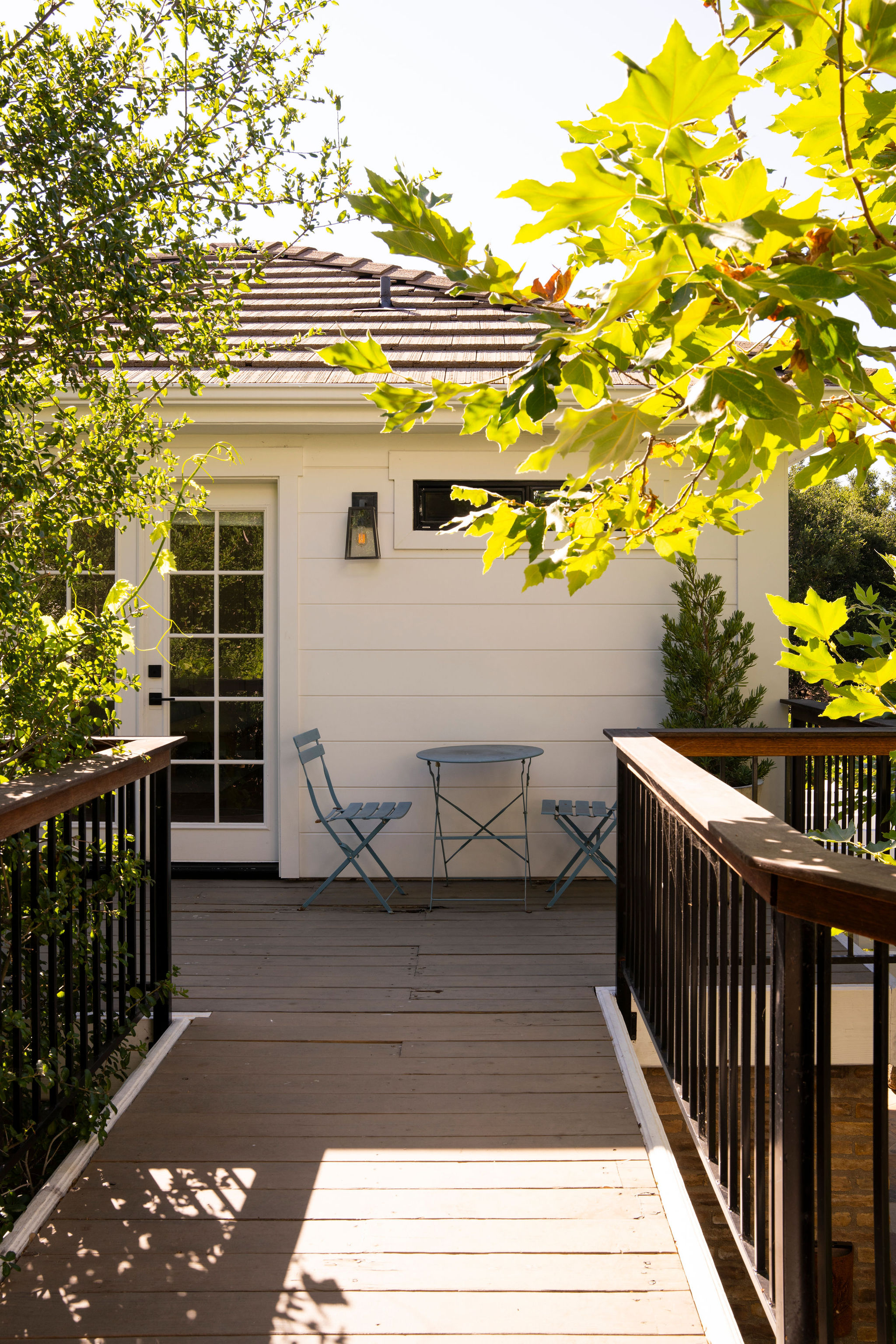 560 Cold Canyon Road Calabasas, CA 91302 - Photo 47 of 84 a view of a balcony with wooden floor and a potted plant