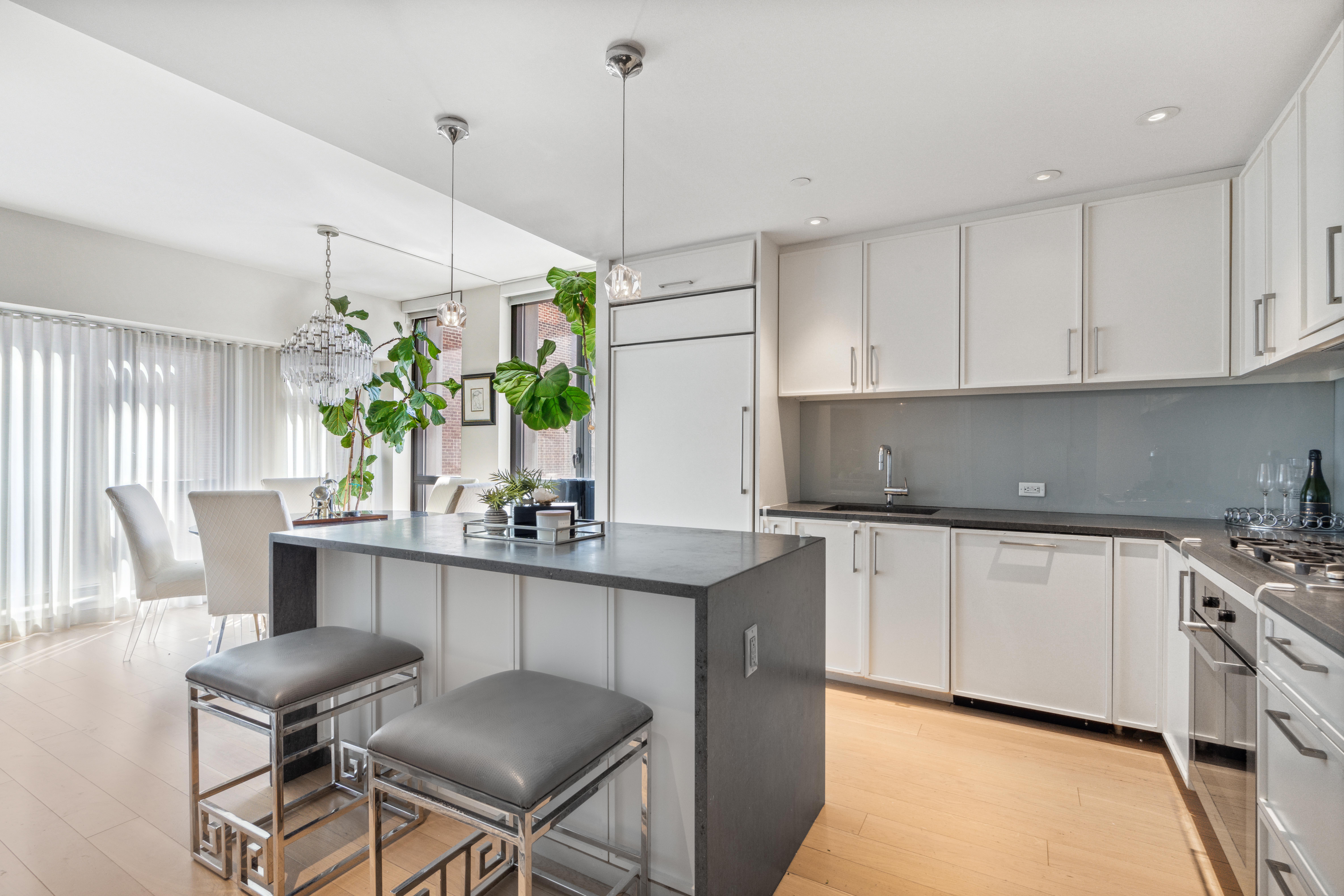 160 East 22nd Street, Unit 9E Manhattan, NY 10010 - Photo 4 of 17 a kitchen with a table and chairs in it