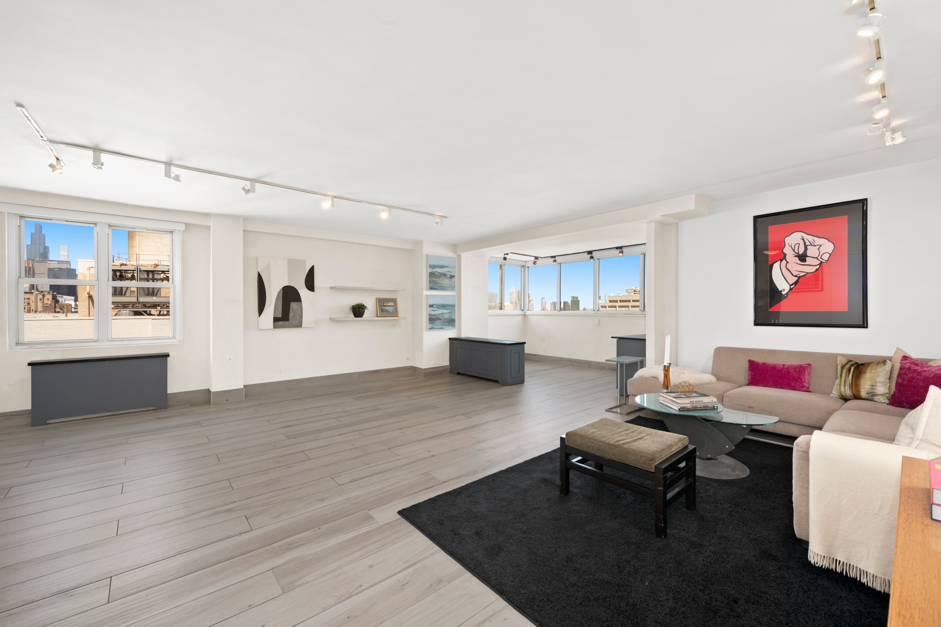 142 East 16th Street, Unit 22B Manhattan, NY 10003 - Photo 2 of 15 a living room with furniture and wooden floor