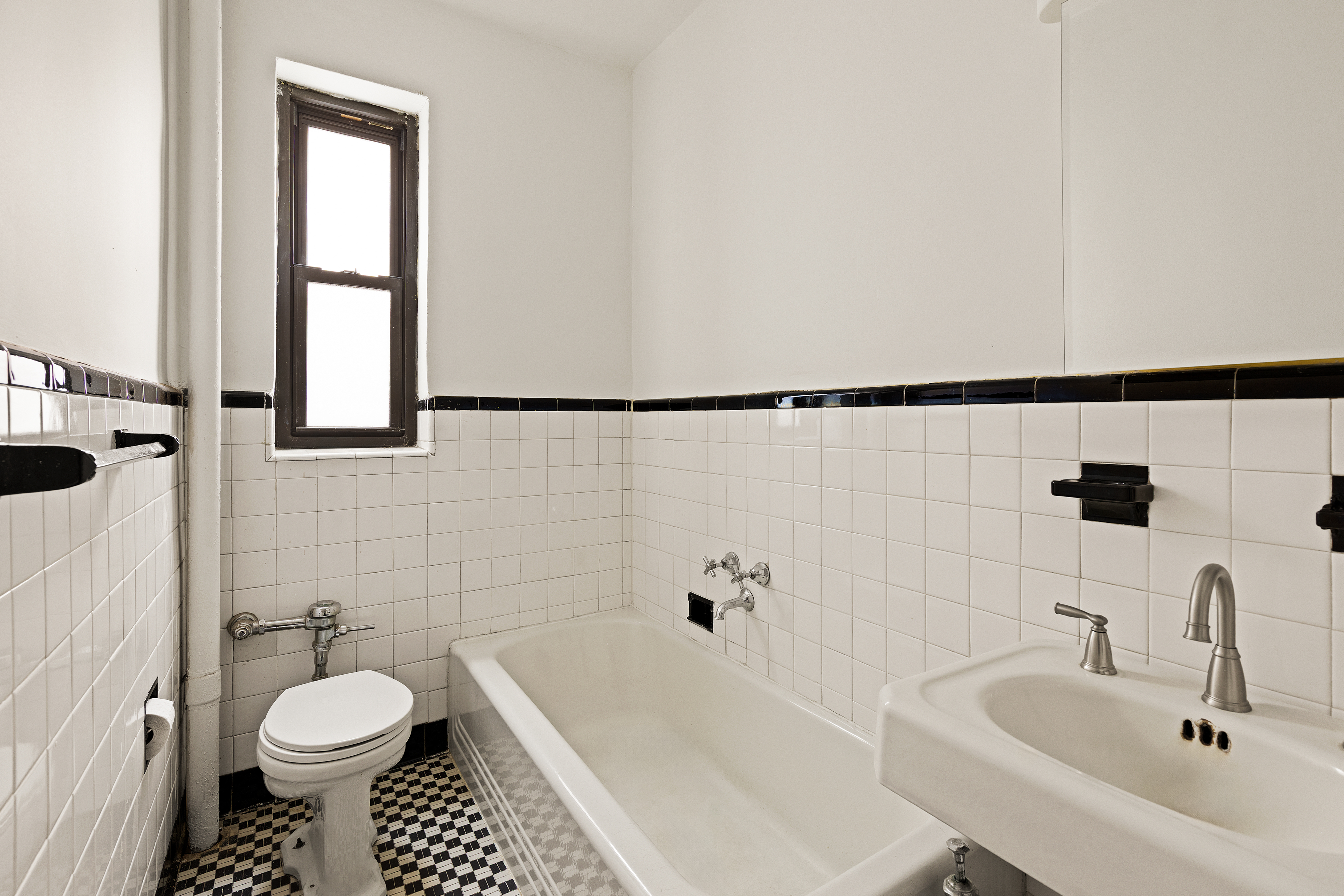 235 Lincoln Place, Unit 2D Brooklyn, NY 11217 - Photo 5 of 6 a bathroom with a sink toilet and shower