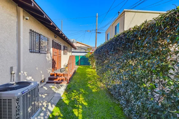 a backyard of a house with lots of green space
