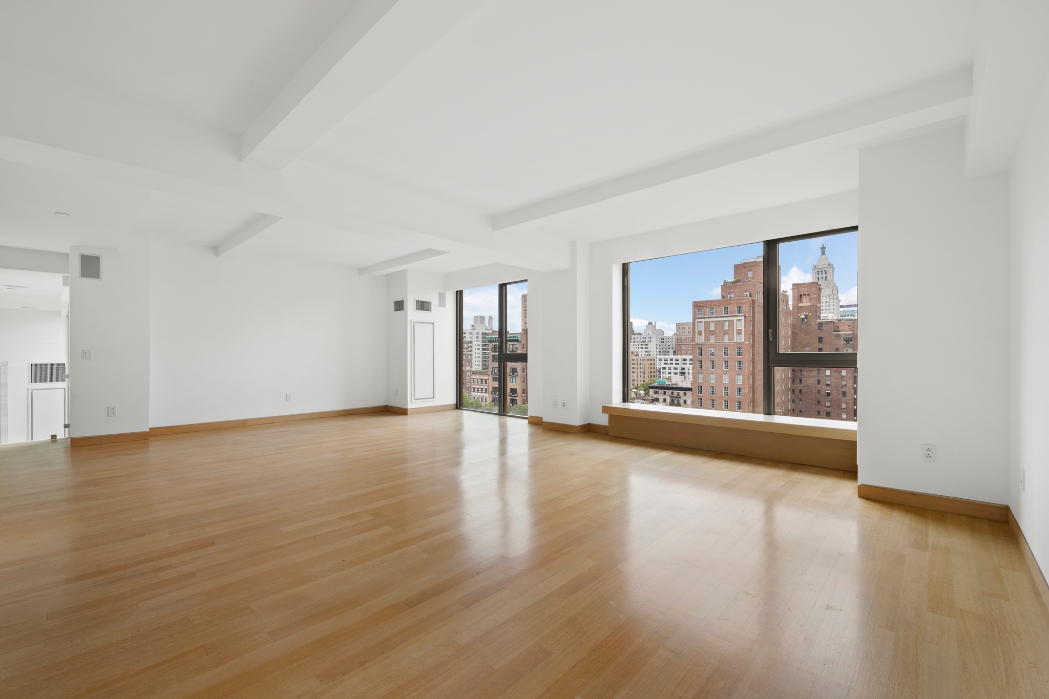 50 Gramercy Park North, Unit 15A Manhattan, NY 10010 - Photo 12 of 29 a view of an empty room with wooden floor and a window
