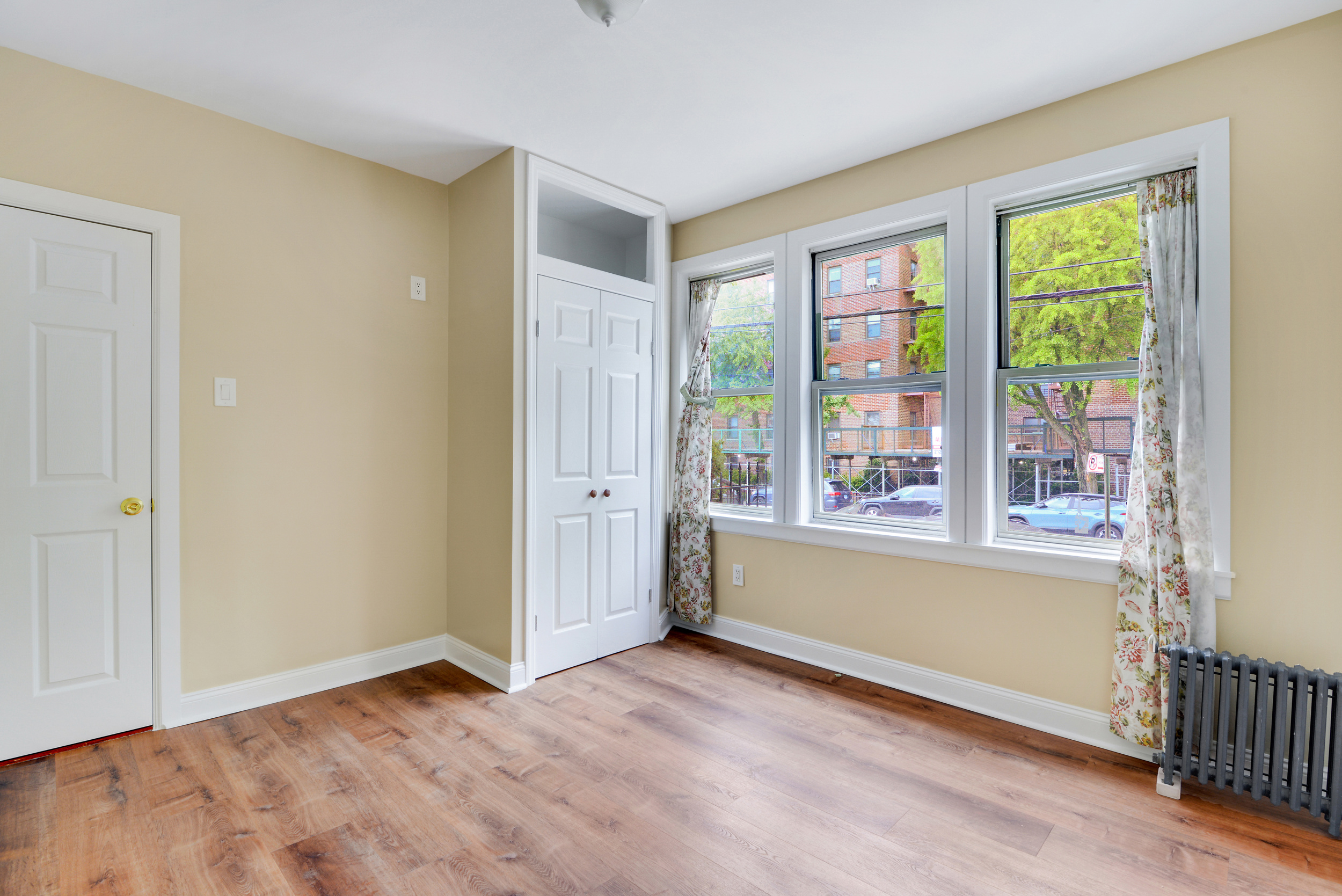 91-11 32nd Avenue, Unit 2 Queens, NY 11369 - Photo 4 of 9 a view of an empty room with a window