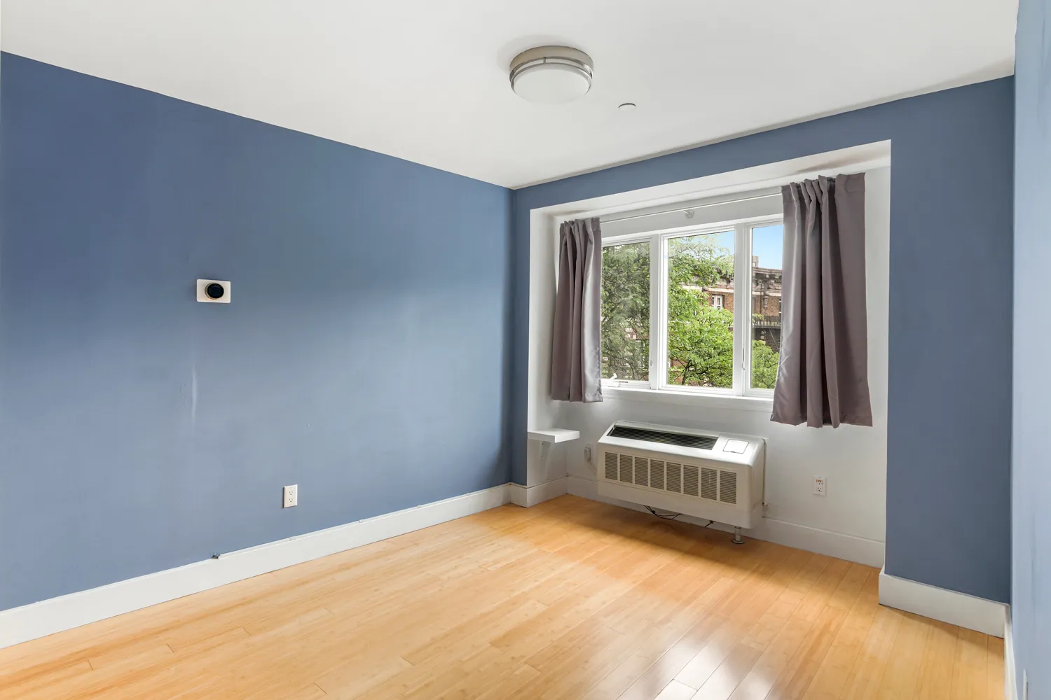 a view of an empty room with a window