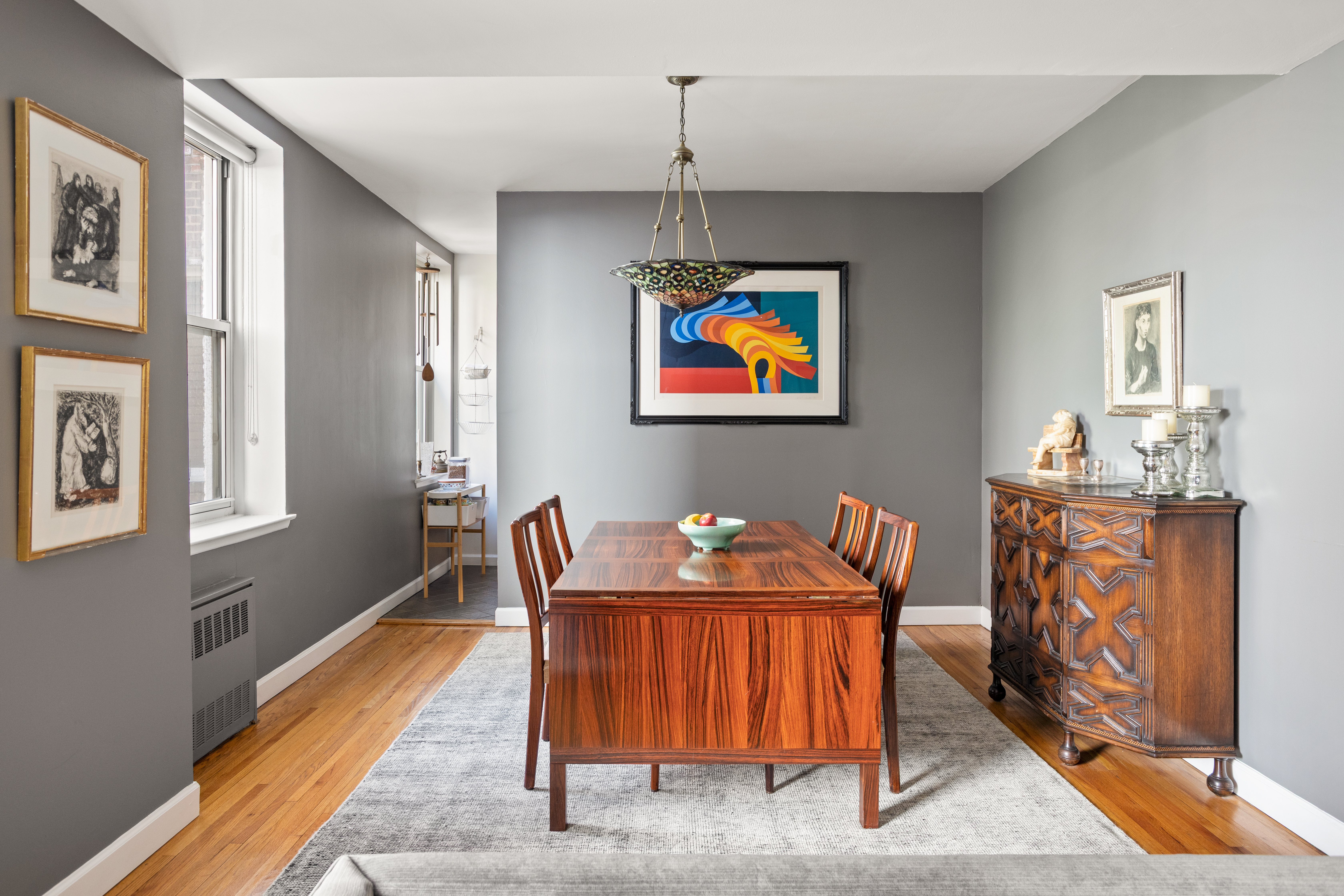 161 East 90th Street, Unit 3B Manhattan, NY 10128 - Photo 2 of 11 a dining room with furniture and wooden floor