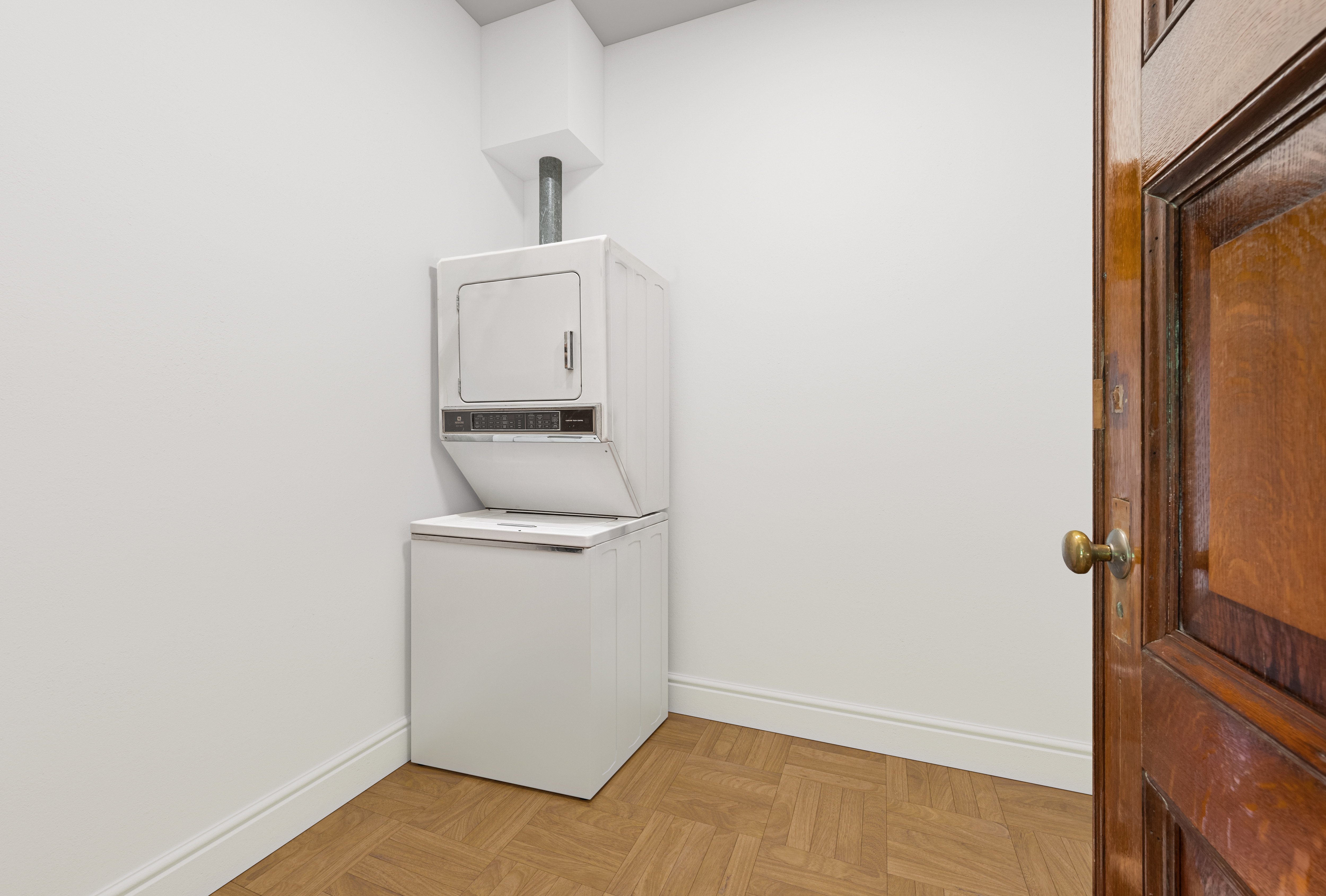293 Riverside Drive, Unit 3A/4A Manhattan, NY 10025 - Photo 7 of 9 a utility room with dryer and washer