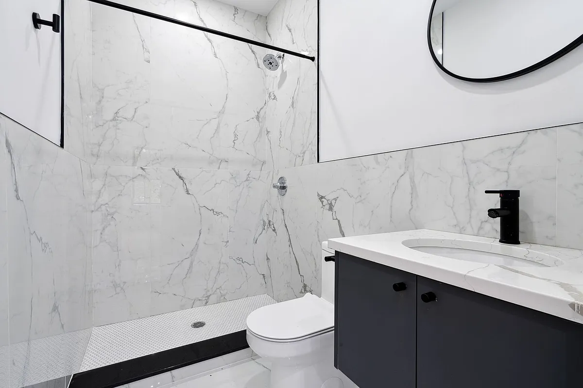 203 Cornelia Street, Unit 2 Brooklyn, NY 11221 - Photo 7 of 9 a bathroom with a sink toilet and shower