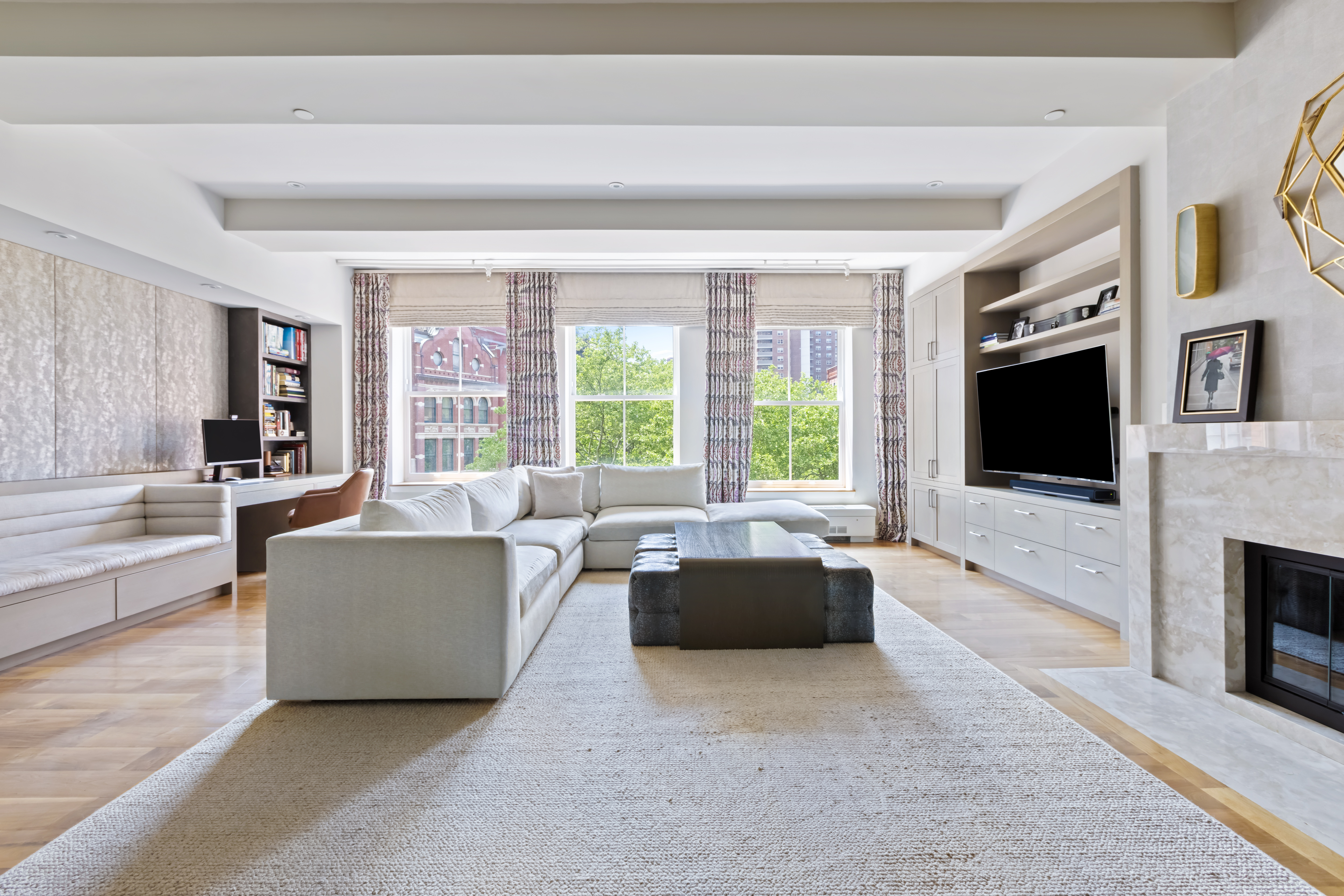 a living room with fireplace furniture and a flat screen tv