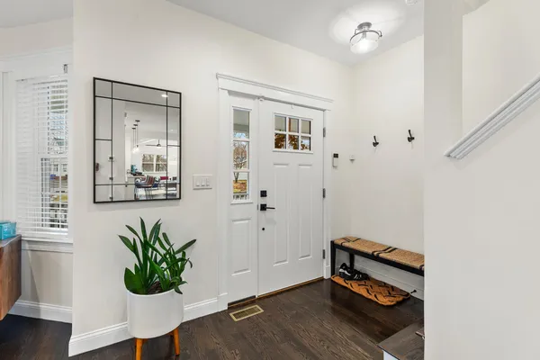 a view of a dining room with furniture window and wooden floor