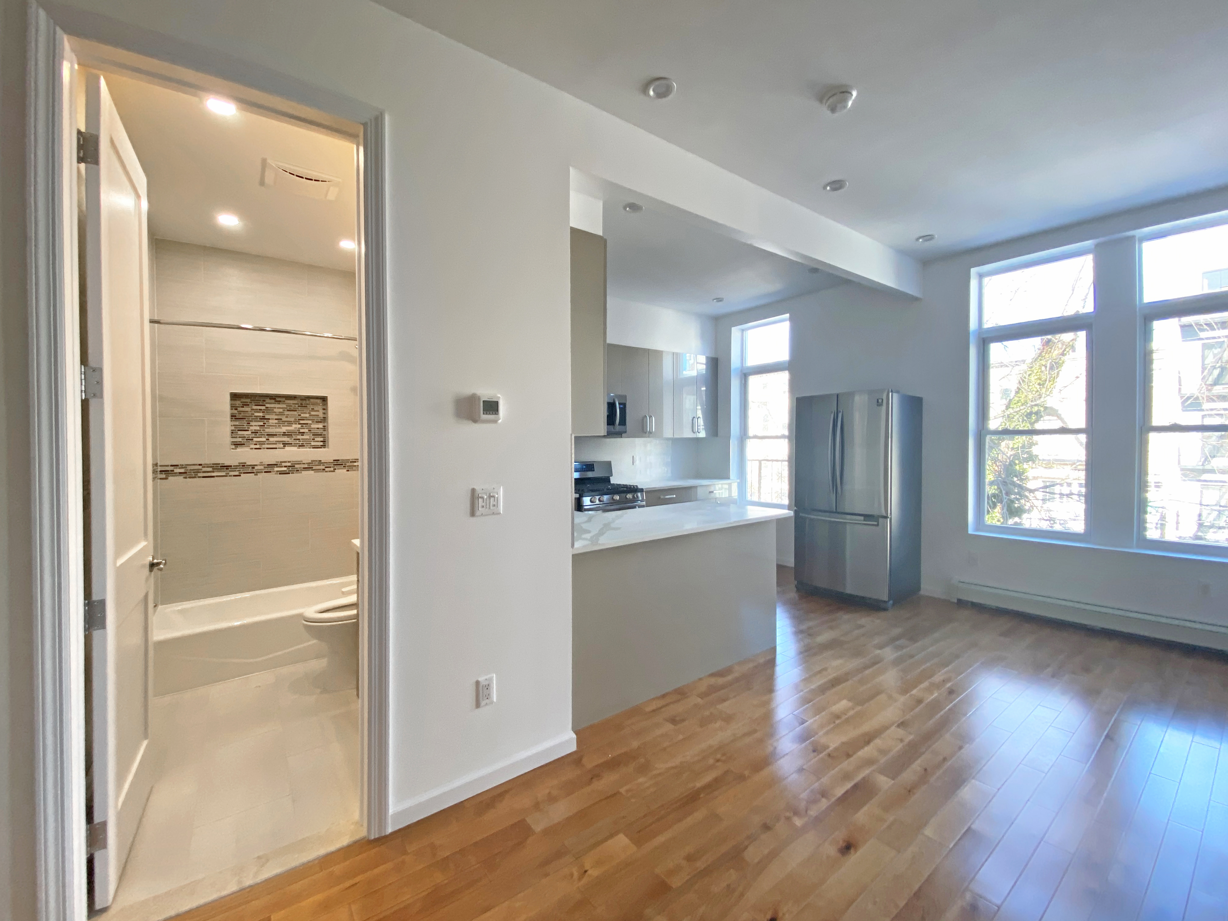 175 Luquer Street, Unit 3 Brooklyn, NY 11231 - Photo 5 of 12 a view of kitchen with wooden floor