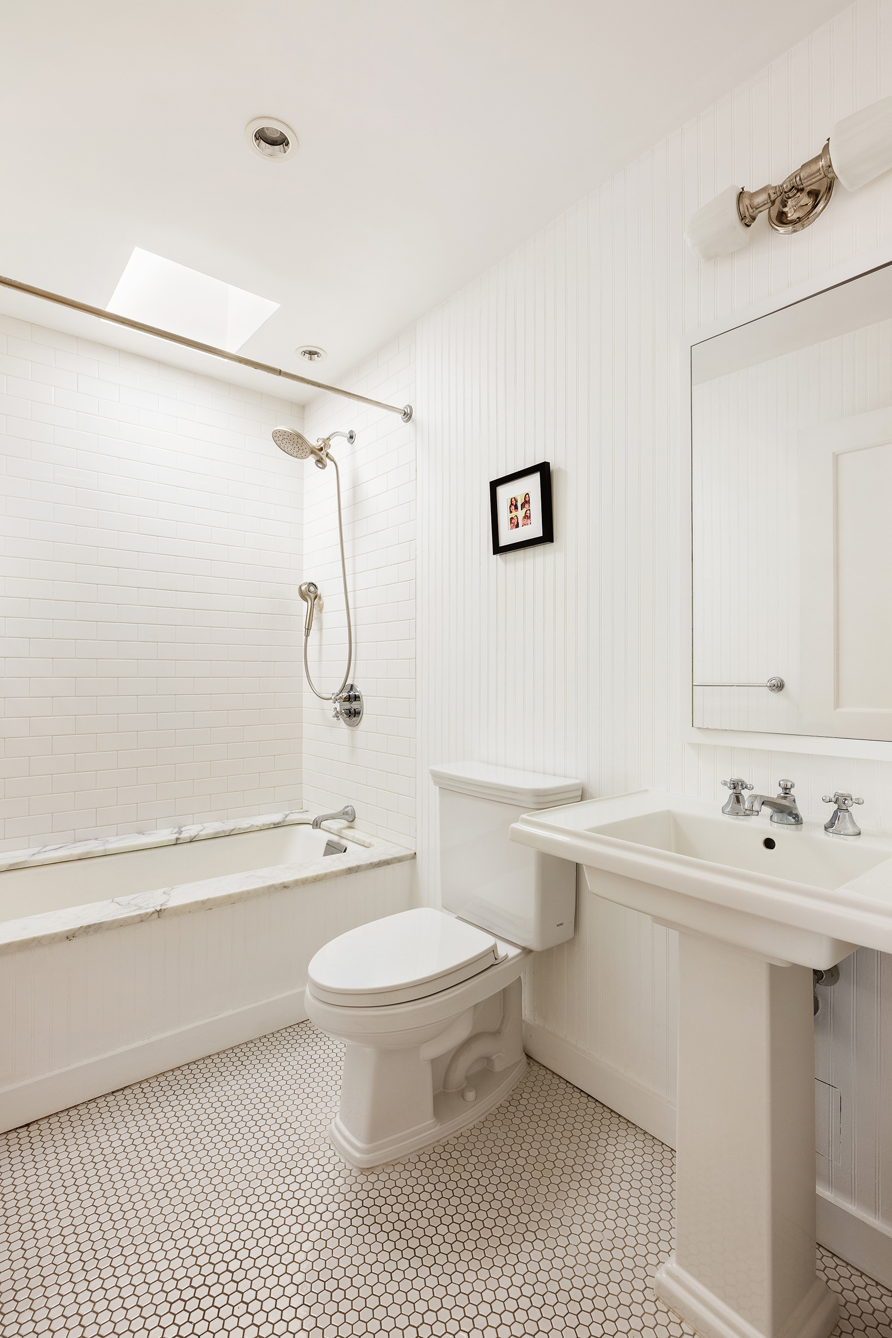 338 Metropolitan Avenue Brooklyn, NY 11211 - Photo 12 of 18 a bathroom with a sink a toilet a mirror and shower