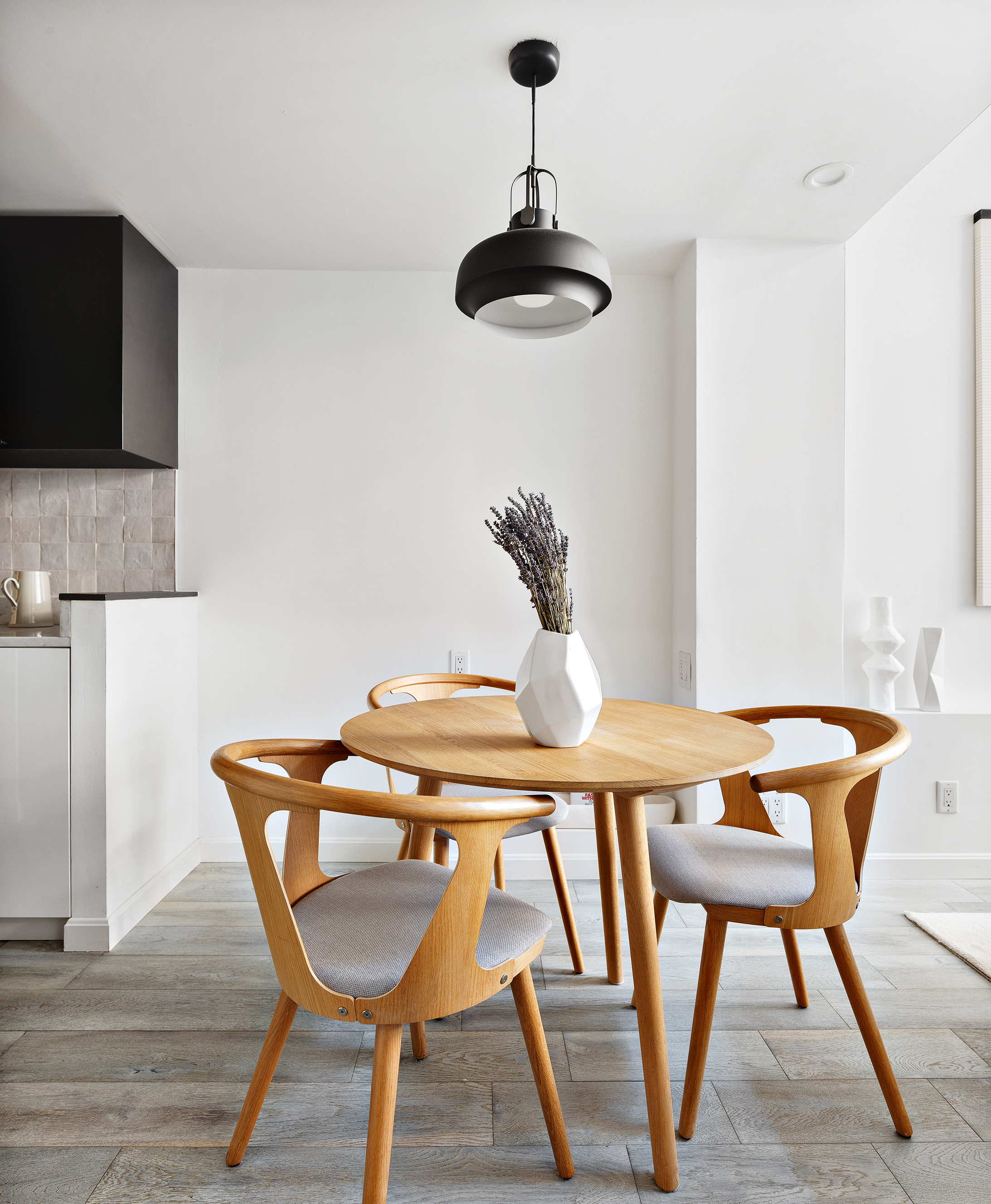 155 West 15th Street, Unit 1J Manhattan, NY 10011 - Photo 6 of 13 a view of a dining room with furniture and wooden floor