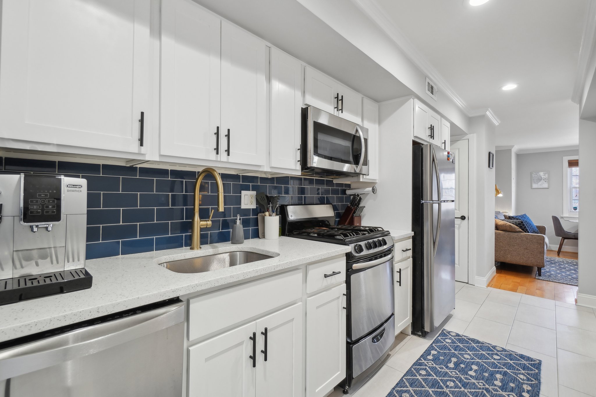 123 17th Street Southeast Washington, DC 20003 - Photo 9 of 18 a kitchen with granite countertop a sink a stove and refrigerator