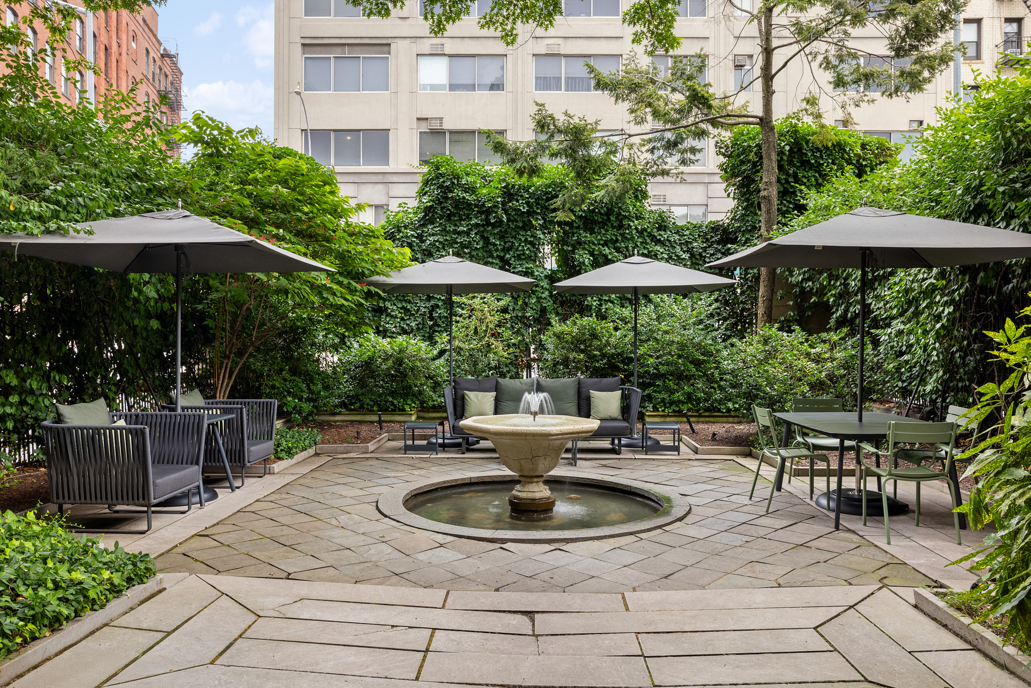 240 Centre Street, Unit 6N Manhattan, NY 10013 - Photo 14 of 16 a patio with a patio table and chairs