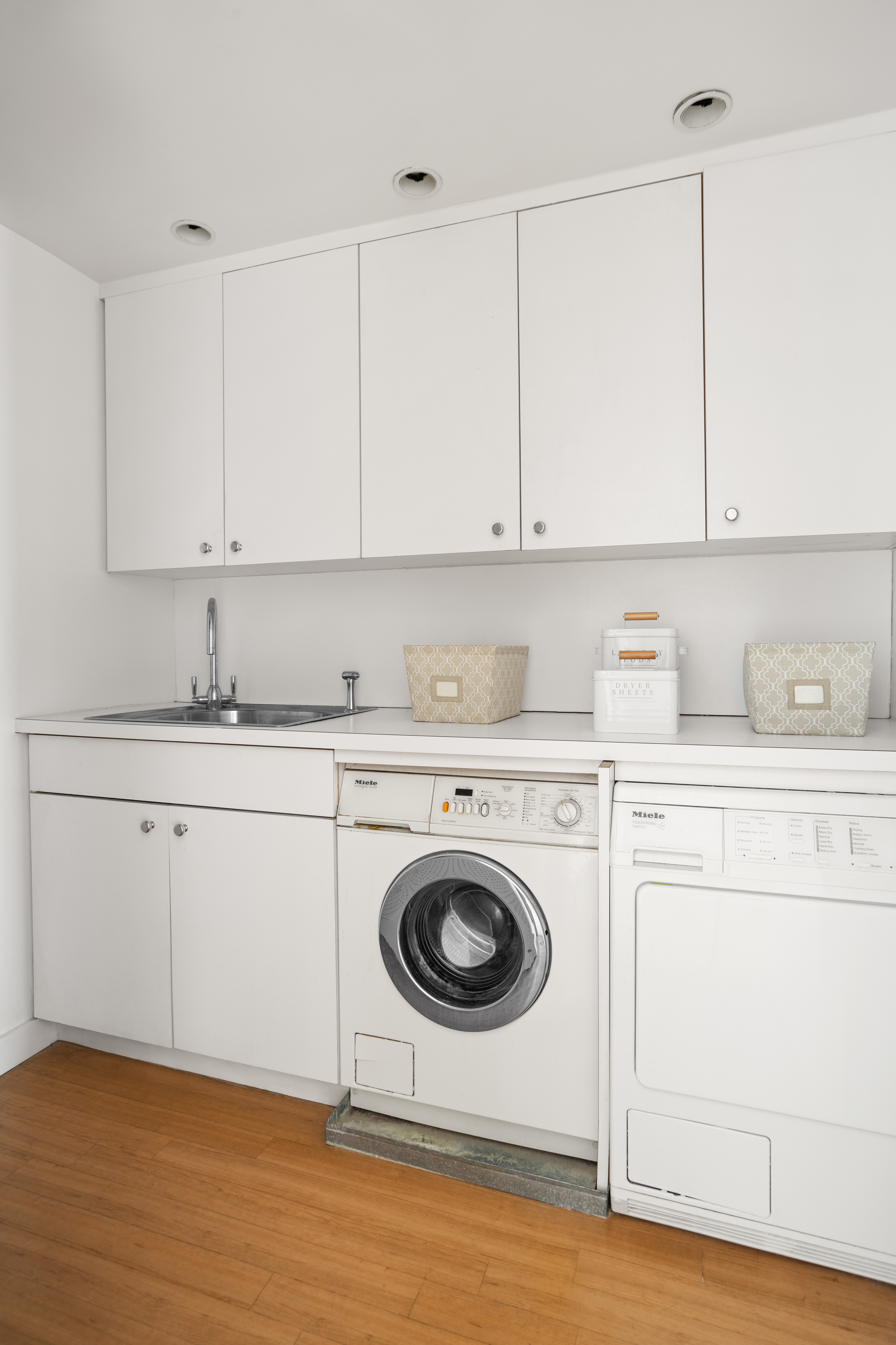 2 5th Avenue, Unit PHDF Manhattan, NY 10011 - Photo 16 of 24 a kitchen with granite countertop a sink a stove and cabinets