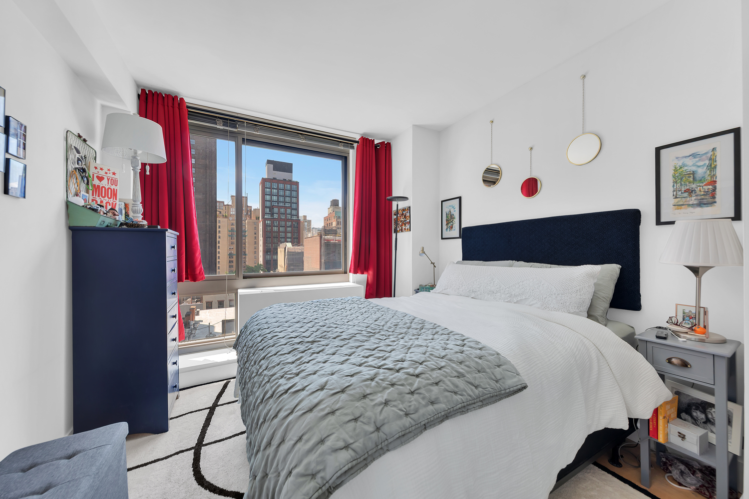 242 East 25th Street, Unit 9B Manhattan, NY 10010 - Photo 4 of 6 a bed sitting in a bedroom next to a window